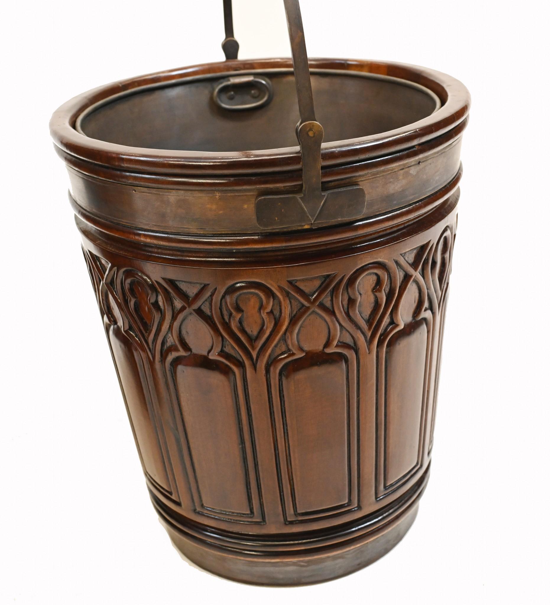Elegant pair of Irish peat buckets with a gothic design
Work well as a pair of decorative planters
Features a copper liner that comes out
Some of our items are in storage so please check ahead of a viewing to see if it is on our shop