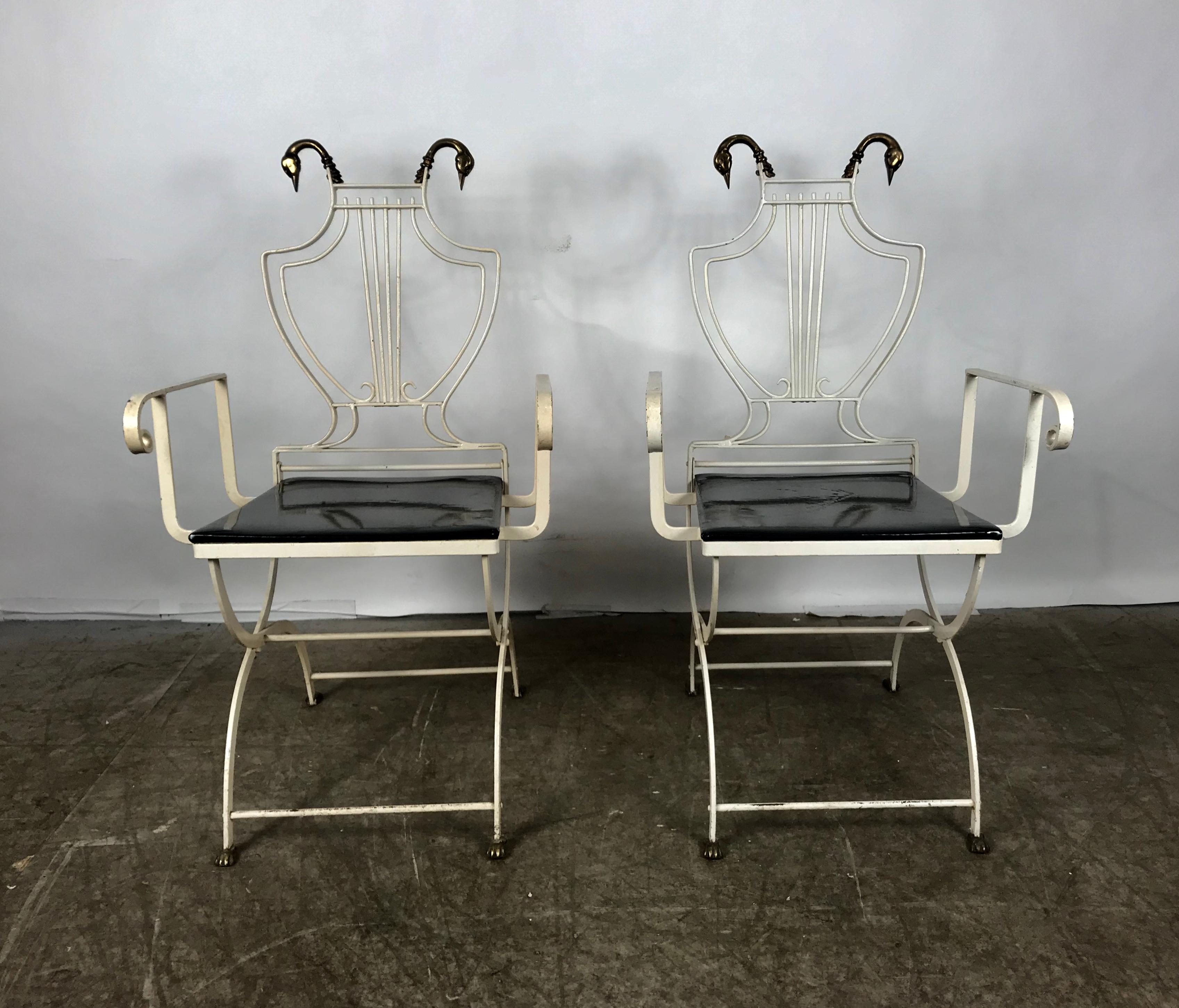 Pair of iron and brass Italian Regency lyre back armchairs with Swans attributed to, Grosfeld House. Brass swan heads and feet, black patent leather seats.