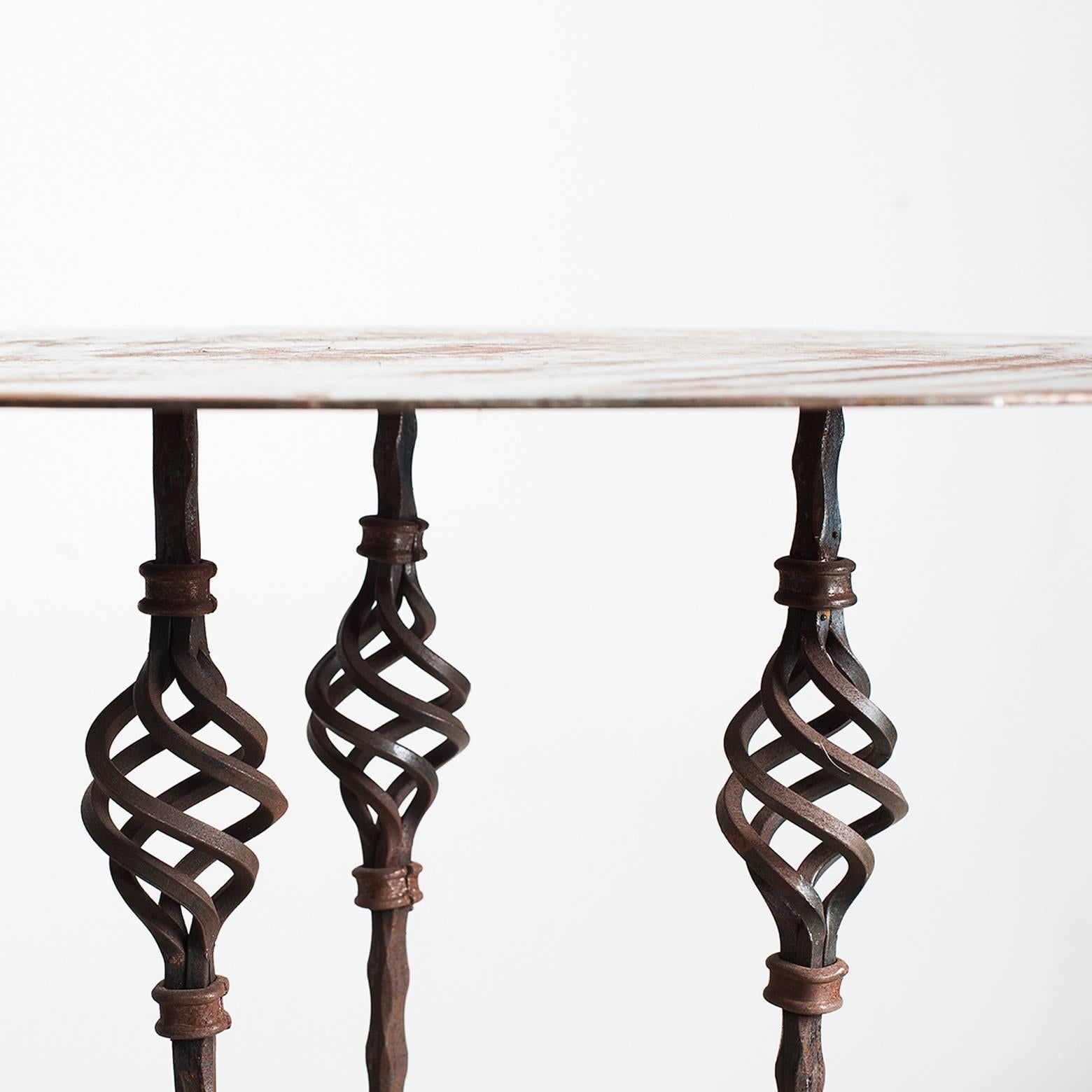 Pair of garden or gueridon tables manufactured in wrought iron.