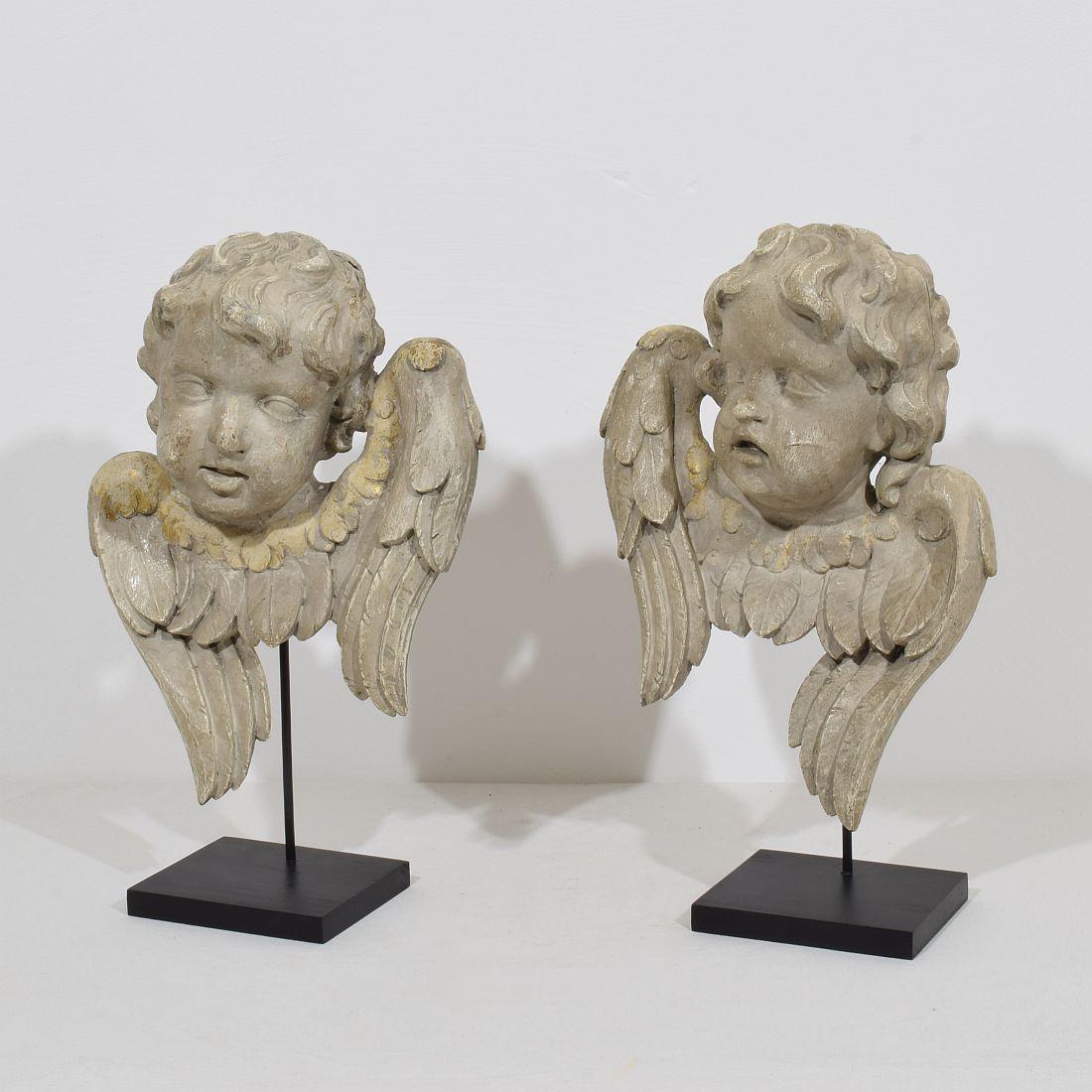 Beautiful and unique hand carved wooden pair of winged angel head ornaments.
Italy, circa 1650-1750.
Weathered and small losses.
Measurement individual and includes the wooden base.
More detailed photo's available on request