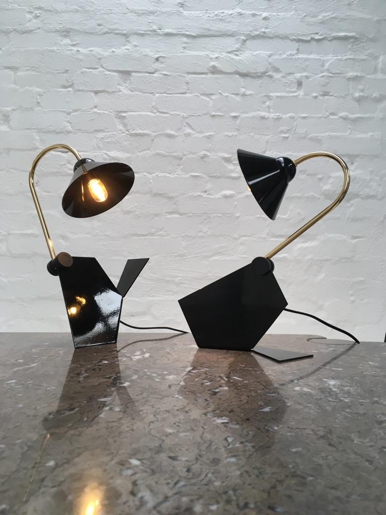 These super fun lamps can be configured in a multitude of ways.

Labeled 'Made in Italy', they remind us of Veneta Lumi lamps, with the same simple design elements. They are not the highest quality lamps but they are in amazing condition and very