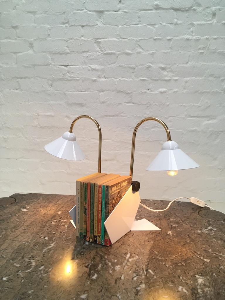 These super fun desk or bedside lamps can be configured in a multitude of ways. See images for just a few of the options. 

Labeled 'Made in Italy', they remind us of Veneta Lumi lamps, with the same simple design elements. The lamp is on an