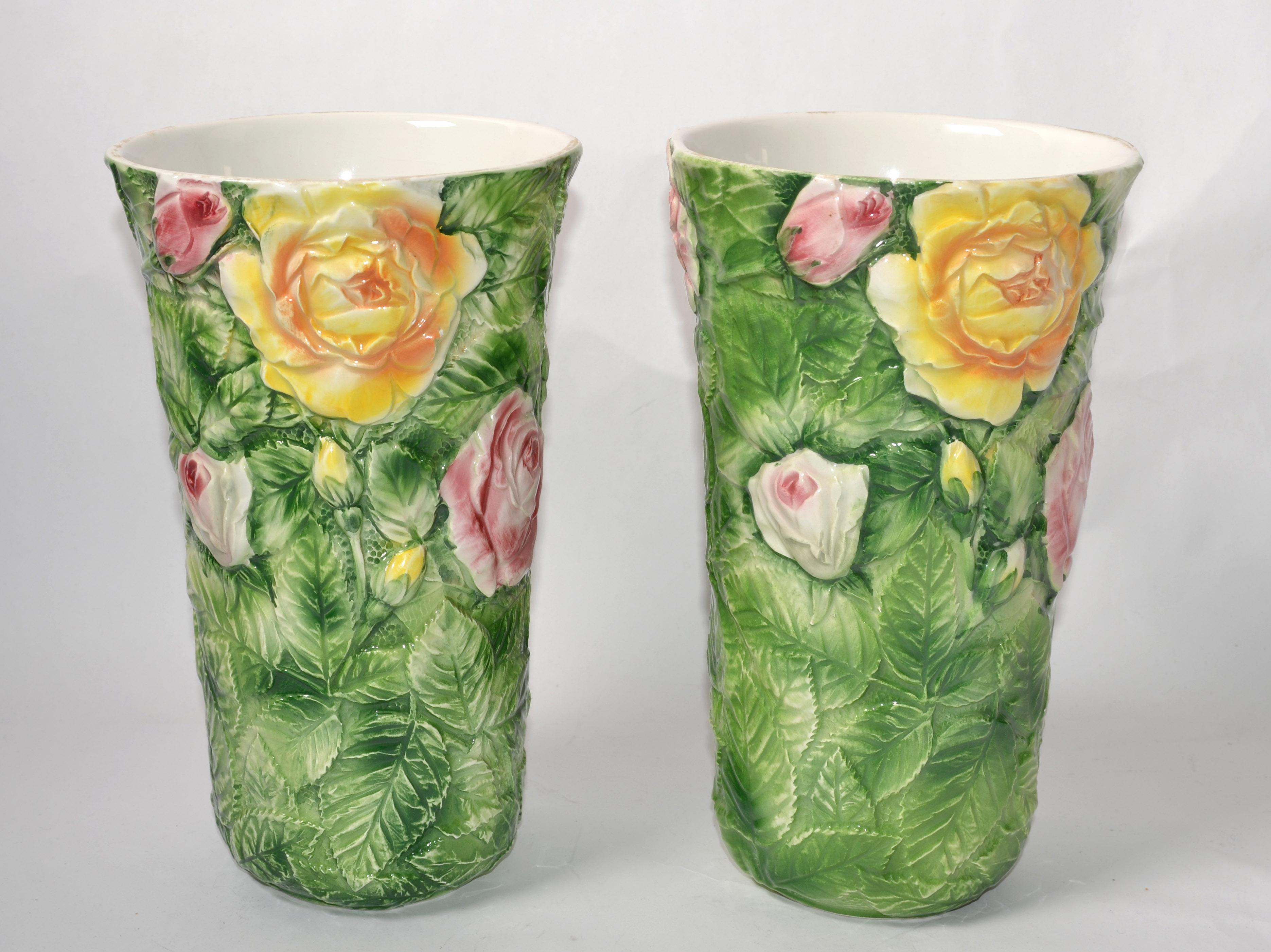 Charming Set of Vintage Floral 3D Italian Majolica Vases in the Style of Delphin Massier, Vallauris, hand-painted in Green, Pink and Yellow Colors.
Depicting Roses and the Leaves hand-carved and made out of glazed Ceramic.
Marked at the Base,