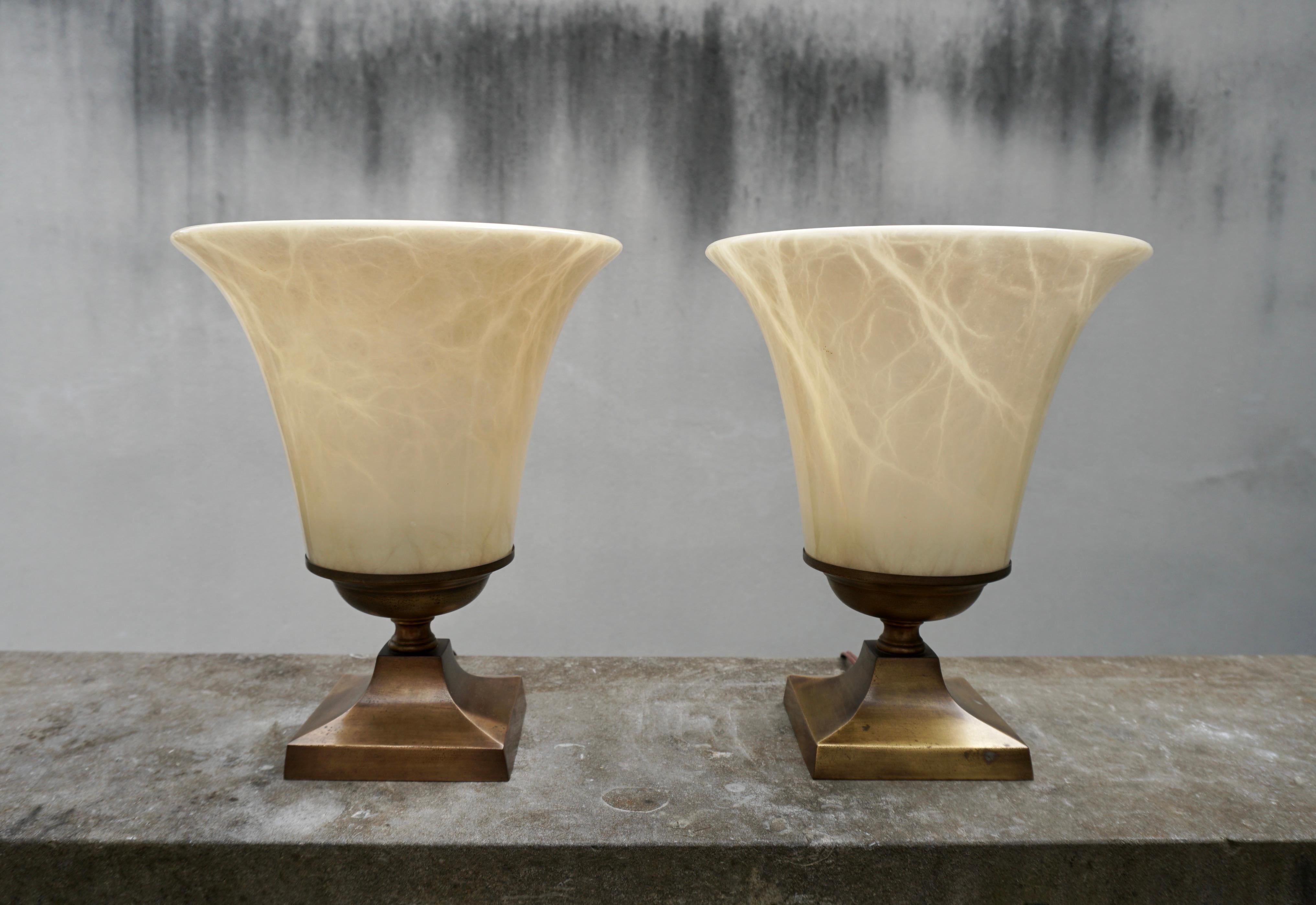 Beautiful alabaster table lamp from Italy, 1970's. Alabaster shows stunning veins and coloring. Vintage piece shows signs of age with some scuffs. Takes one E27 base bulb, 40W or higher using LED. Two available.