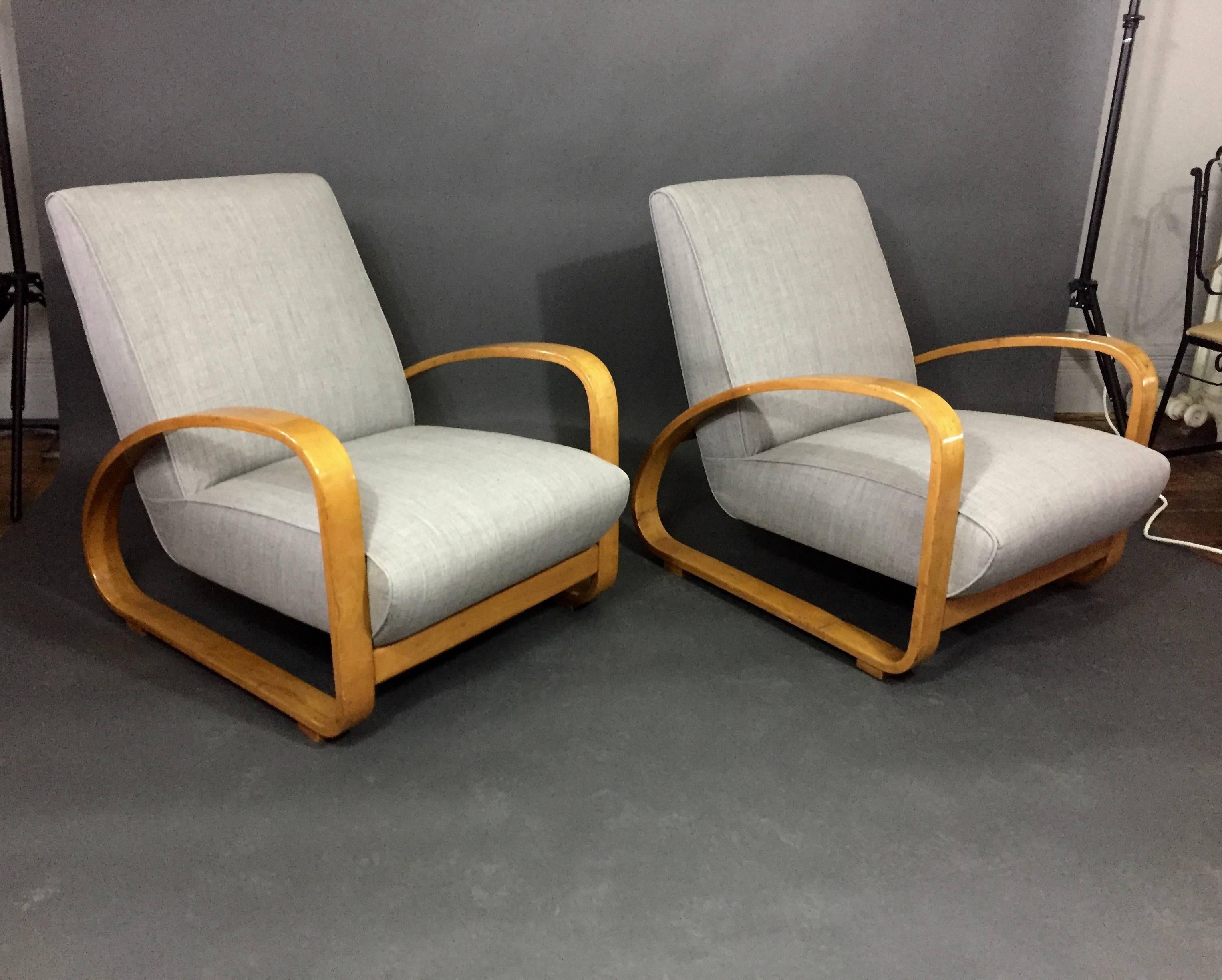 With a hint of 1930s Art Deco styling in the beautiful long arc to the bentwood arms, this pair is made in solid beech with a top lacquer finish. Seating is recently updated with Maharam fabric in light gray to compliment the frame color, Italy,
