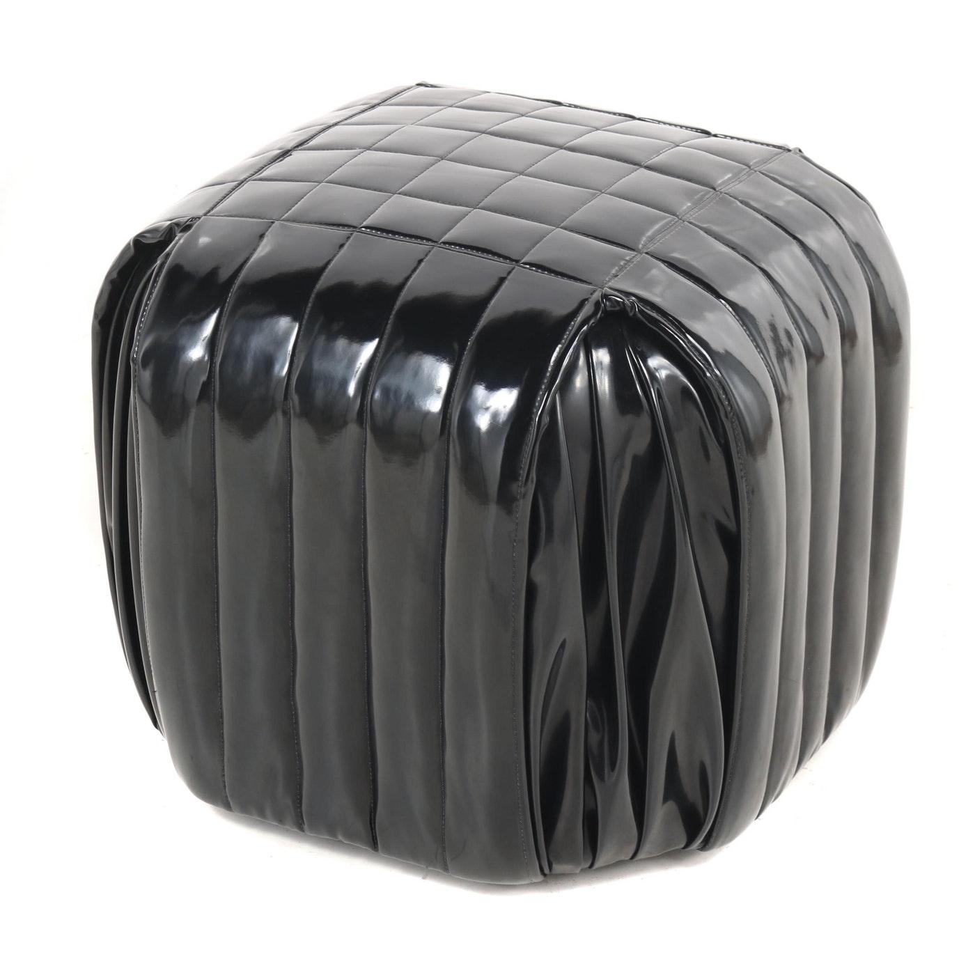 The Minimalist Italian design. Wrapped in black patent leather stools or poufs on wood feet. Quilted with a modern square stitch. The poufs are in very good condition with lovely patina. The perfect addition to any space.