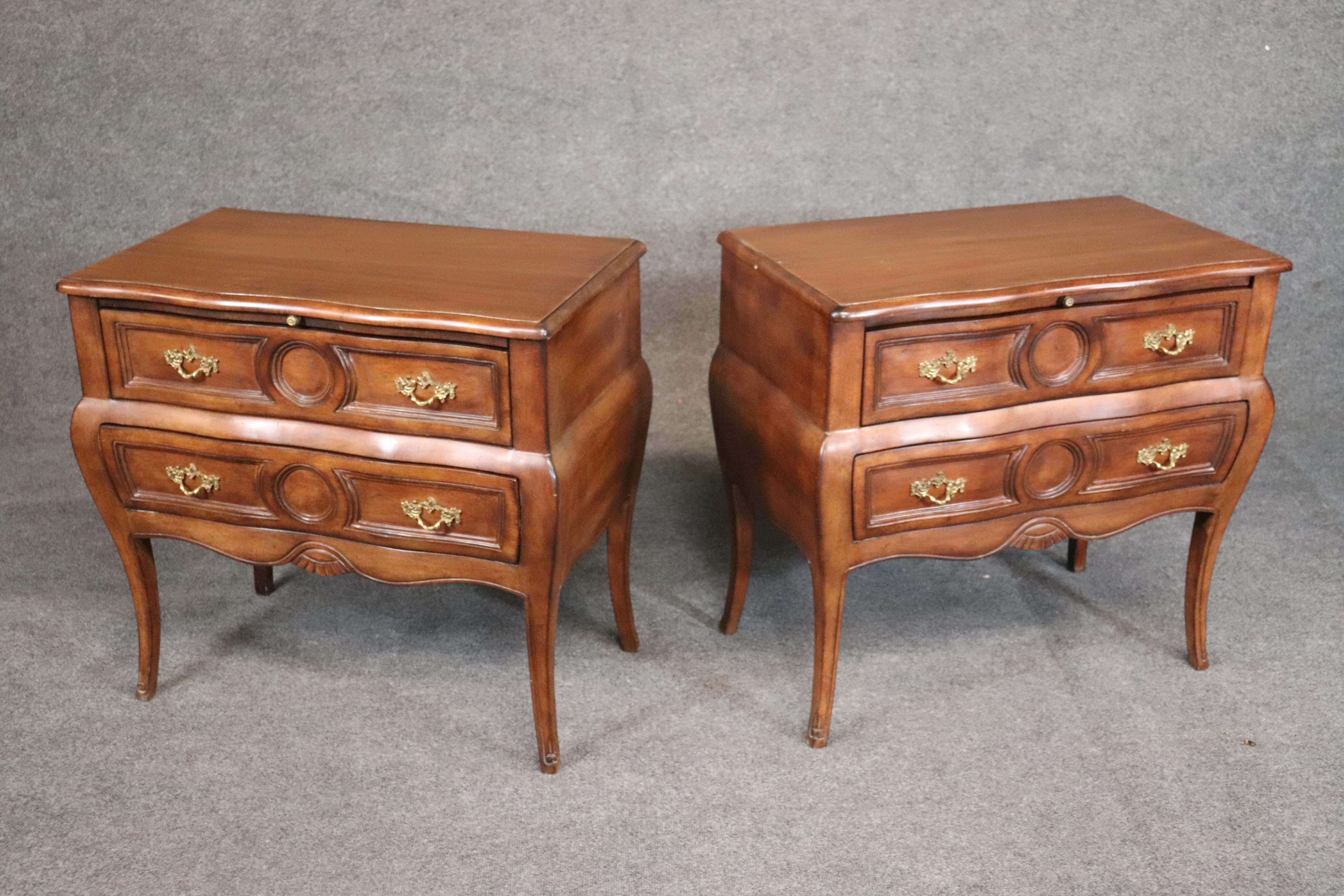 This is a fine pair of Italian-made commodes. Each one fitted with slide out trays for additional utility. They are designed in the Italian provincial manner. They each measure 30 wide x 28.25 tall x 17 deep.