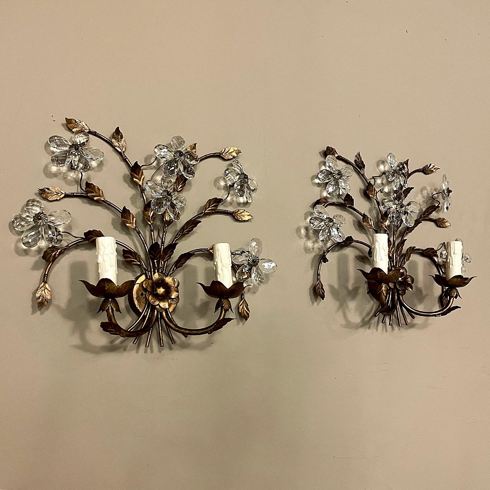 Pair Italian brass & crystal wall sconces will make a delightful addition to your lighting scheme! Artistically sculpted brass depicts a floral bouquet gathered together at a central rosette, with detail abundant in the leaves and stems, and cut