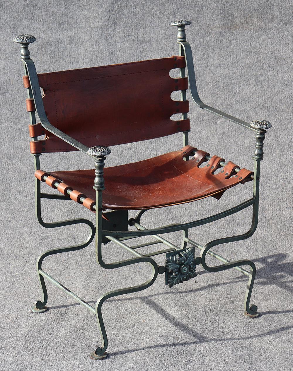 Pair of rare, incredibly sturdy, Italian leather upholstered chairs with iron and bronze details.