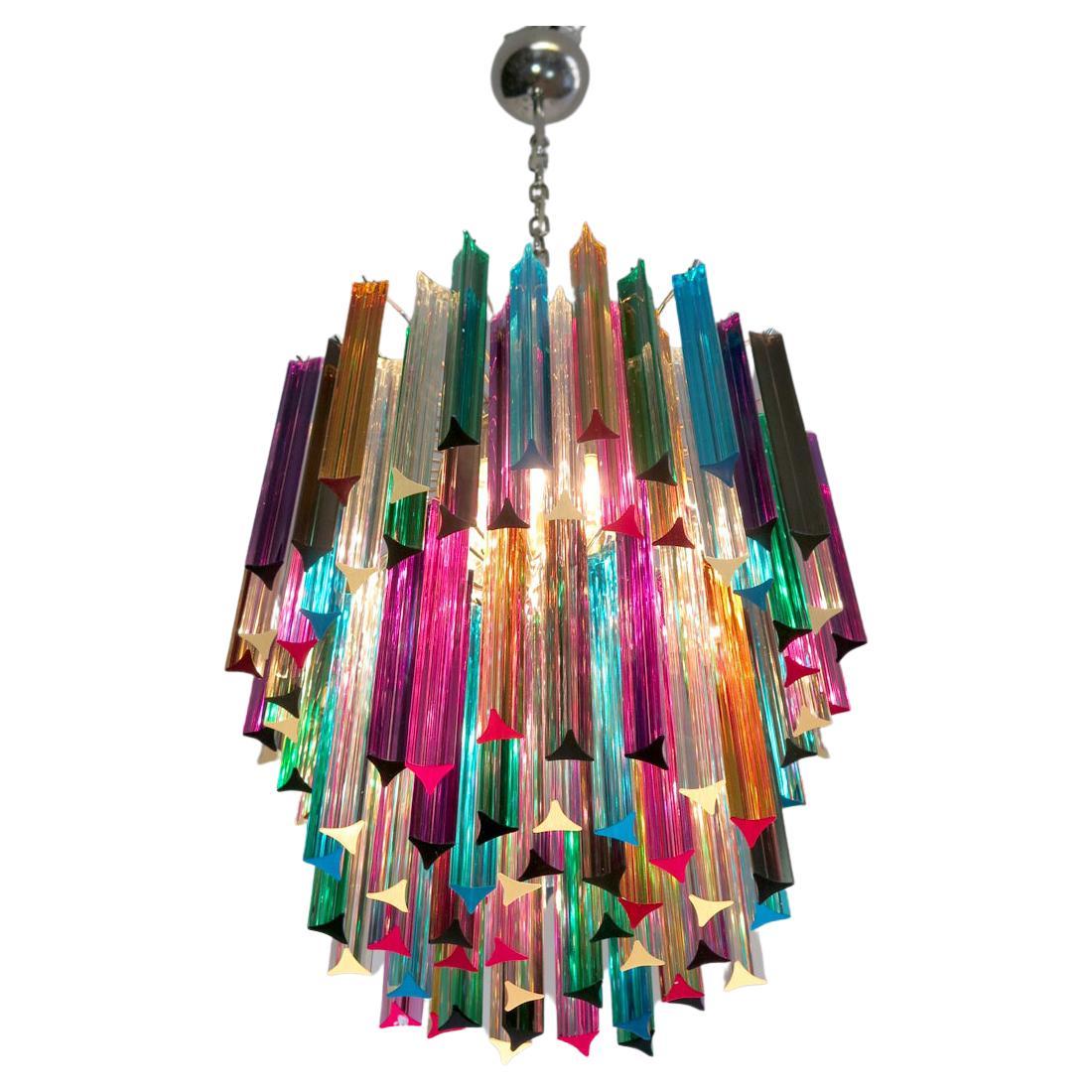 Fantastic Pair chandeliers made by 107 Murano crystal multicolored prism in a nickel metal frame. The glasses are transparent, blue, smoky, purple, green, yellow and pink.
Dimensions: 55.10 inches height (140 cm) with chain, 29.50 inches height (75