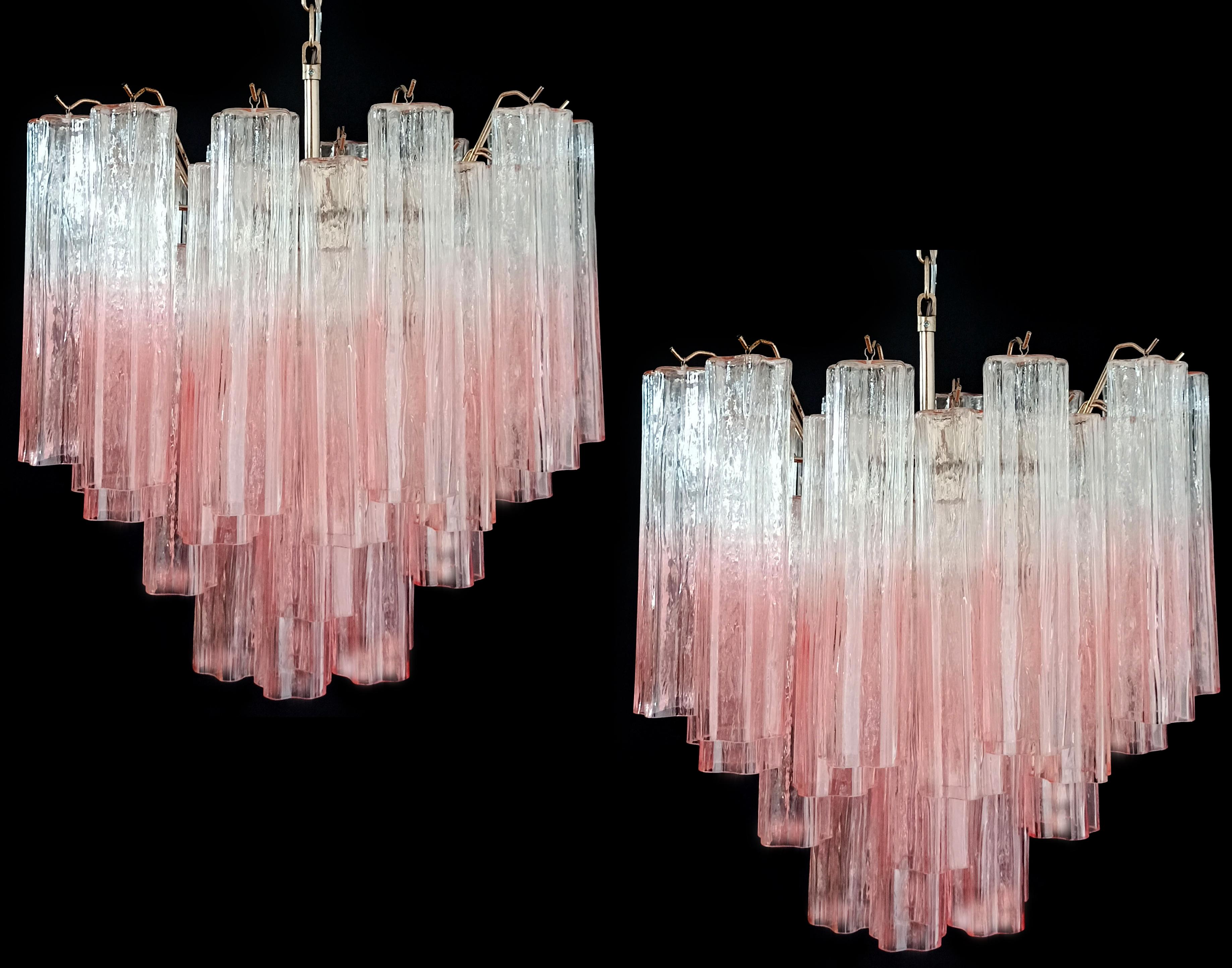 Pair Italian vintage chandeliers in Murano glass and nickel-plated metal structure. The armor polished nickel supports 36 large shaded pink glass tubes in a star shape.
Period:late XX century
Dimensions: 50,40 inches (128 cm) height with chain;