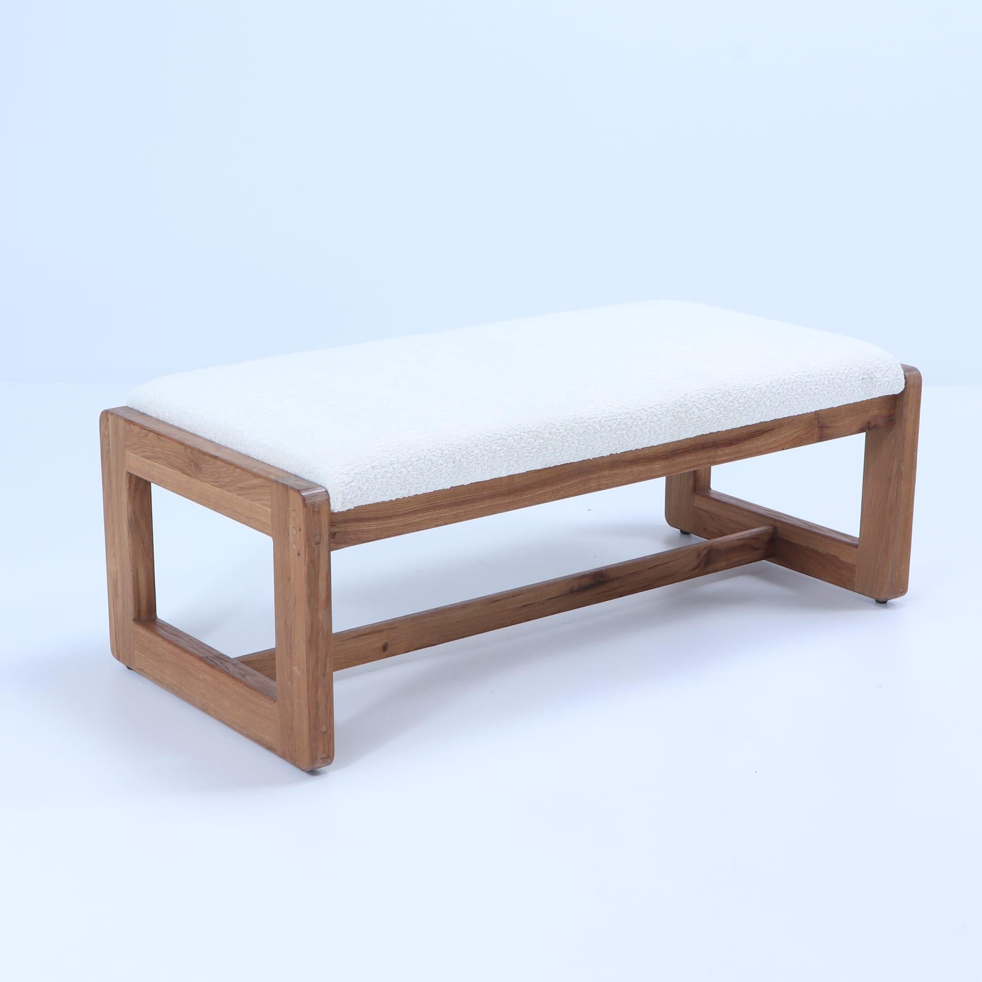 Pair Italian contemporary oak benches done in a boucle white fabric and having deep seats.