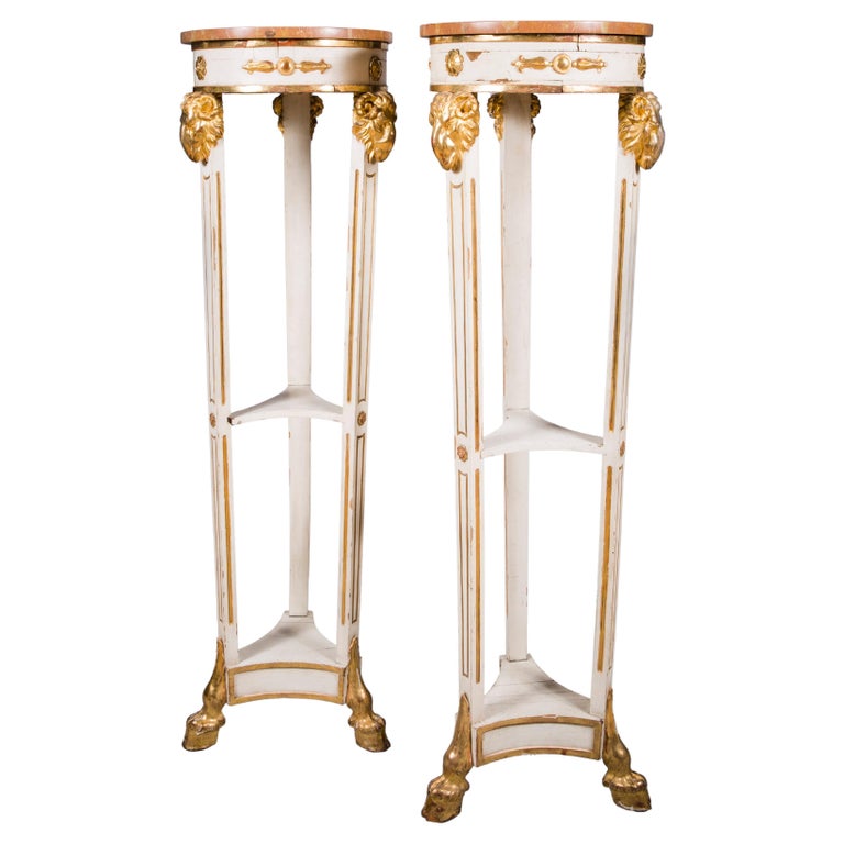 A Pair of 19th Century Parcel Gilt and Painted Neoclassical Style Italian Torcheres A Pair of 19th Century Parcel Gilt and Painted Neoclassical Style Italian Torcheres