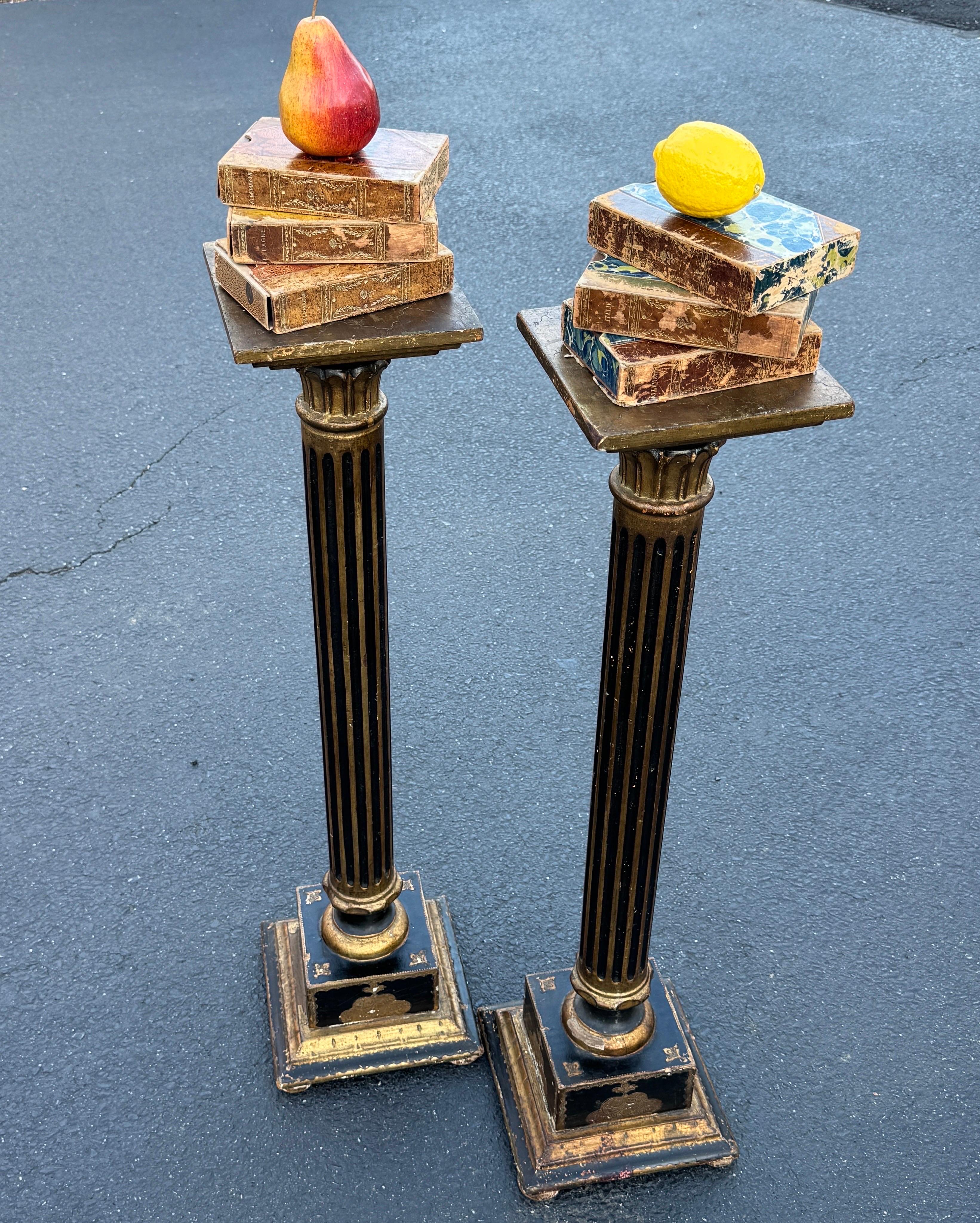 Mid-Century Modern Period Florentine Gold Gilt and Black Painted Pedestals, circa 1950-60's Italy. Classic and versatile Florentine Mid-Century stands. These can be stand-alone statement pieces or functional to hold a plant in any formal or informal