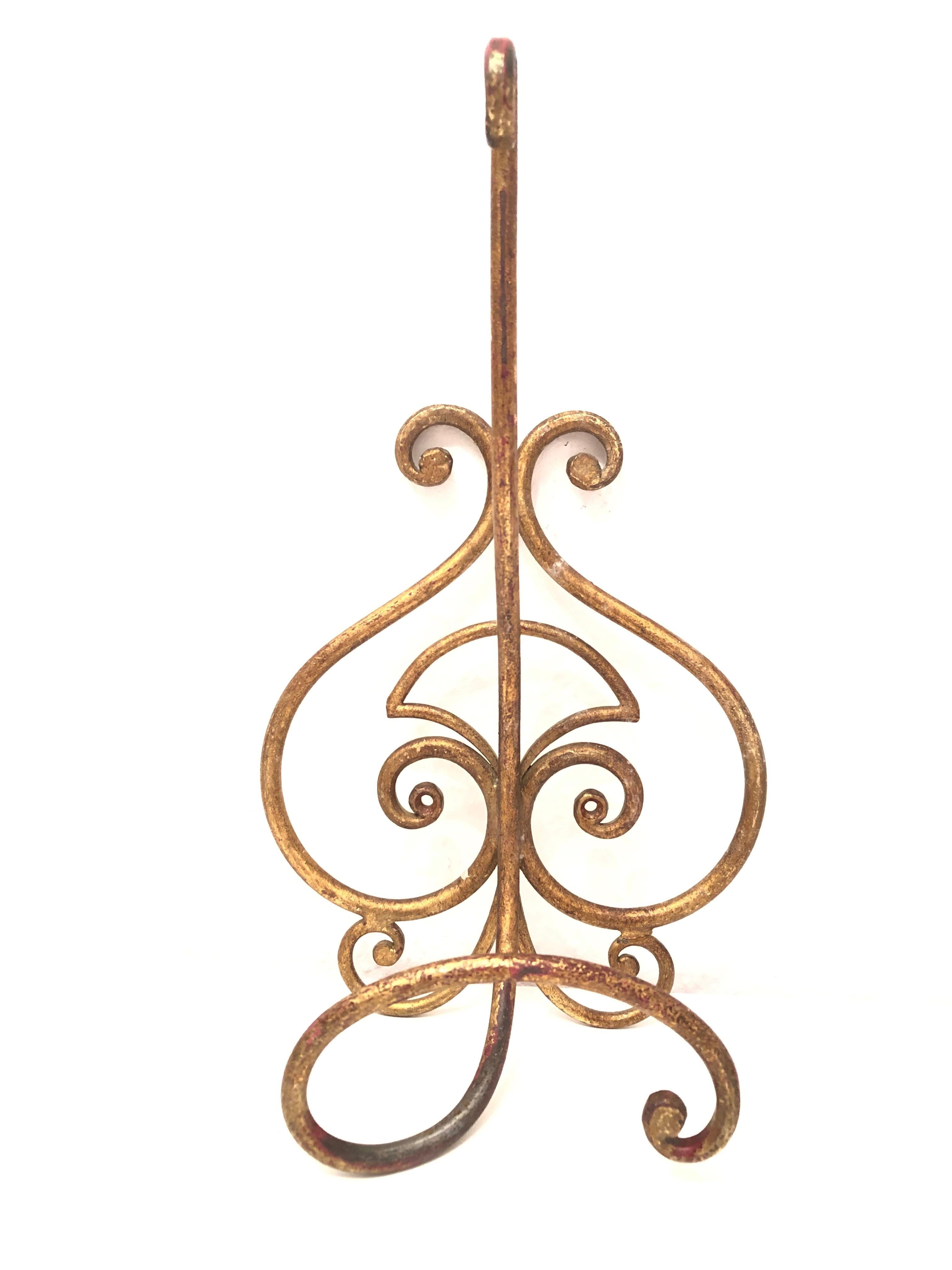 Offered is an absolutely stunning, 1950s Italian gilt metal coat hook set for your hall entry. Minor patina and paint lost gives these pieces a classy statement.