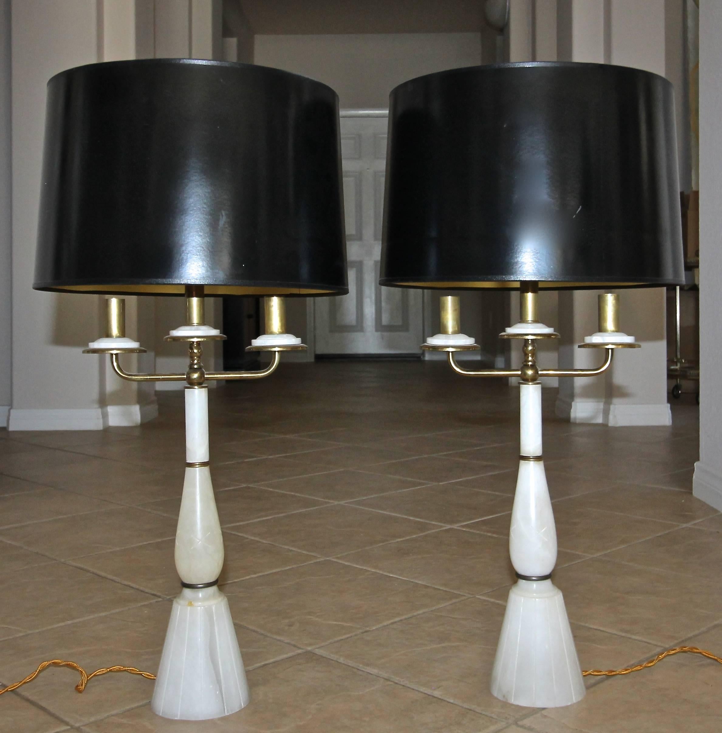 Pair of Gio Ponti style 1940s Italian alabaster candelabra lamps with brass arms and fittings. Newly restored and rewired with full range dimmer socket and rayon covered French style cord. Shades not included for photography purposes only.