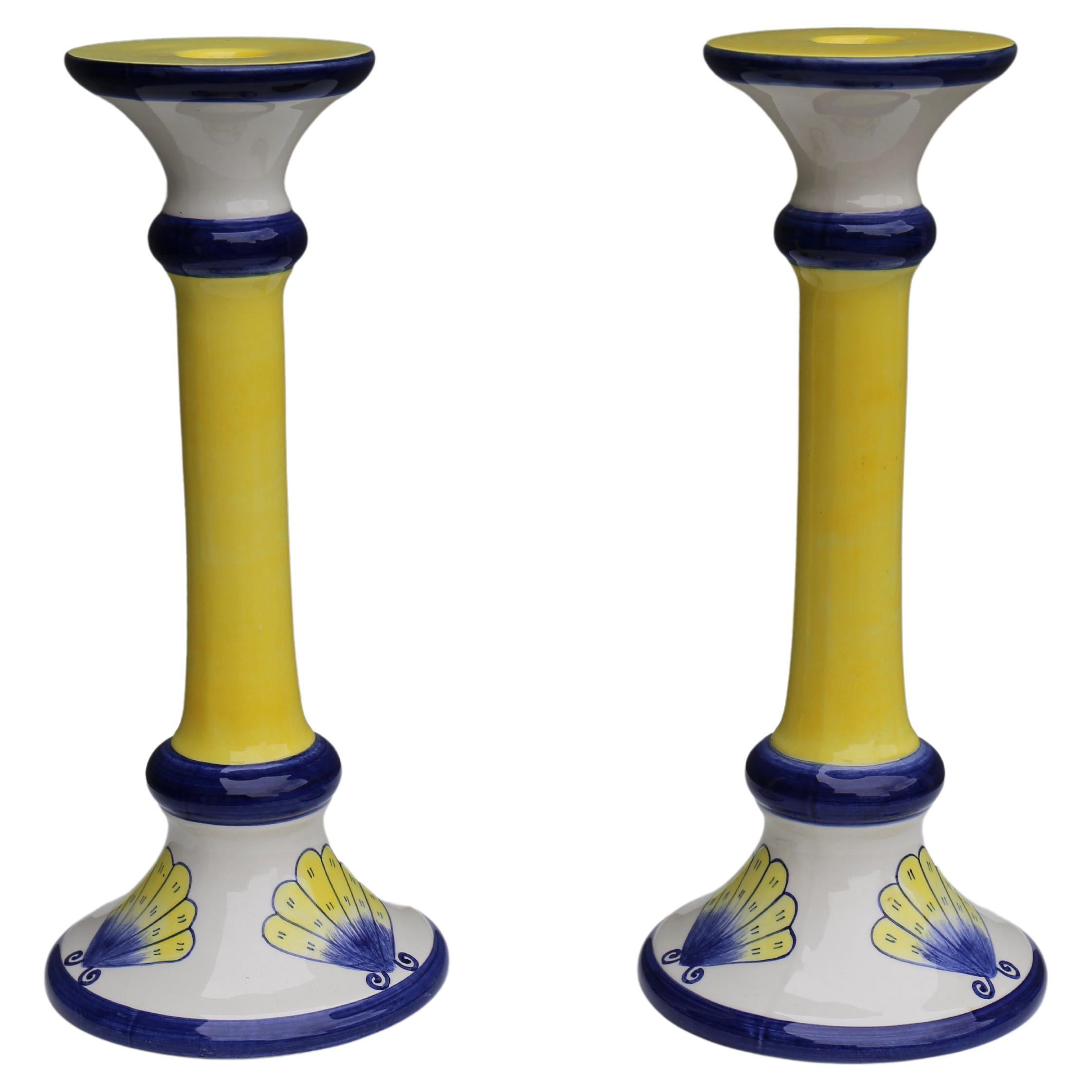 A fine pair of Italian hand painted porcelain candelabra with butterfly decor.

Height 12.2