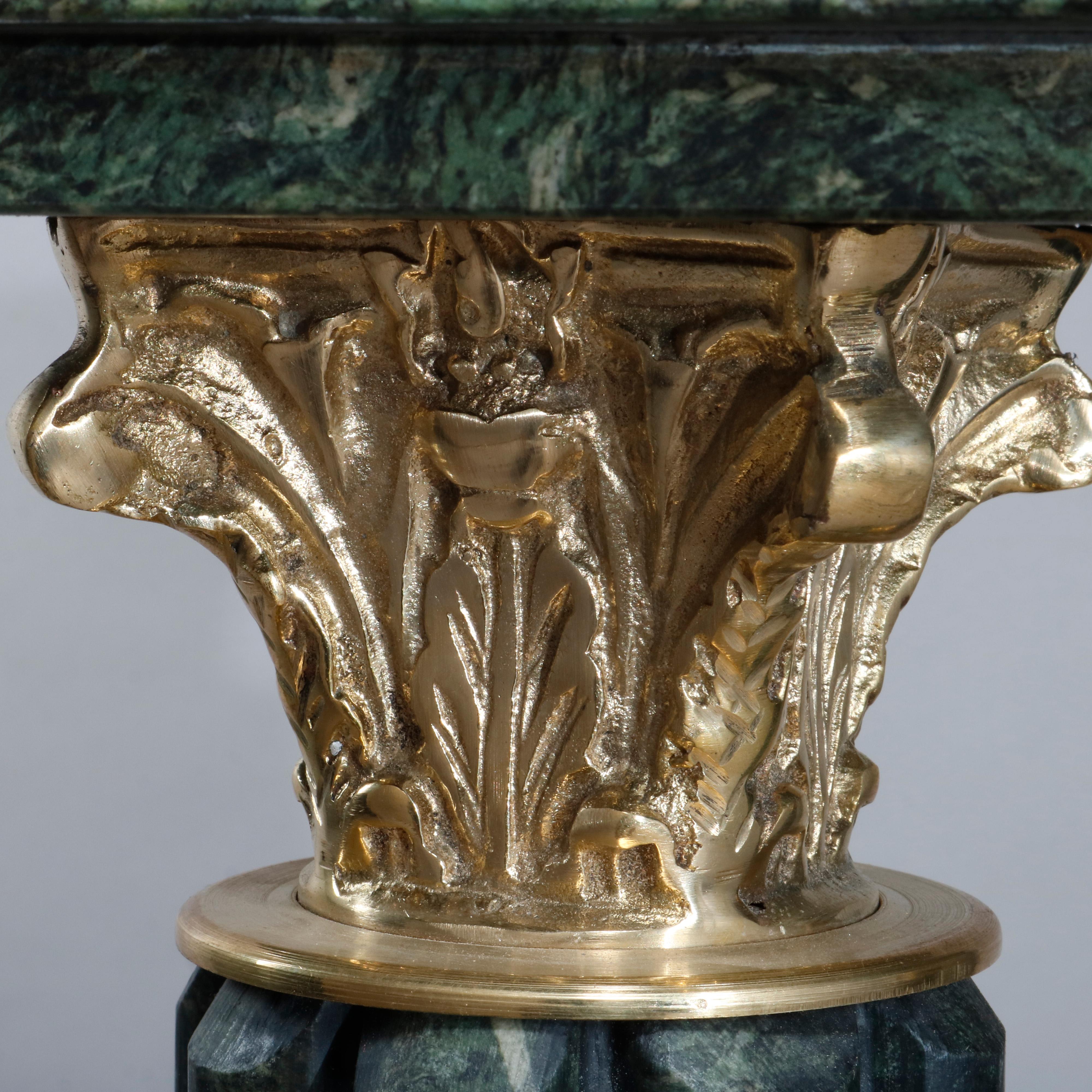 A vintage pair of Italian marble sculpture pedestals offer square displays surmounting cluster columns with acanthus capitals, seated on cube plinths with central star, gilt attachments throughout, 20th century

Measures: 39