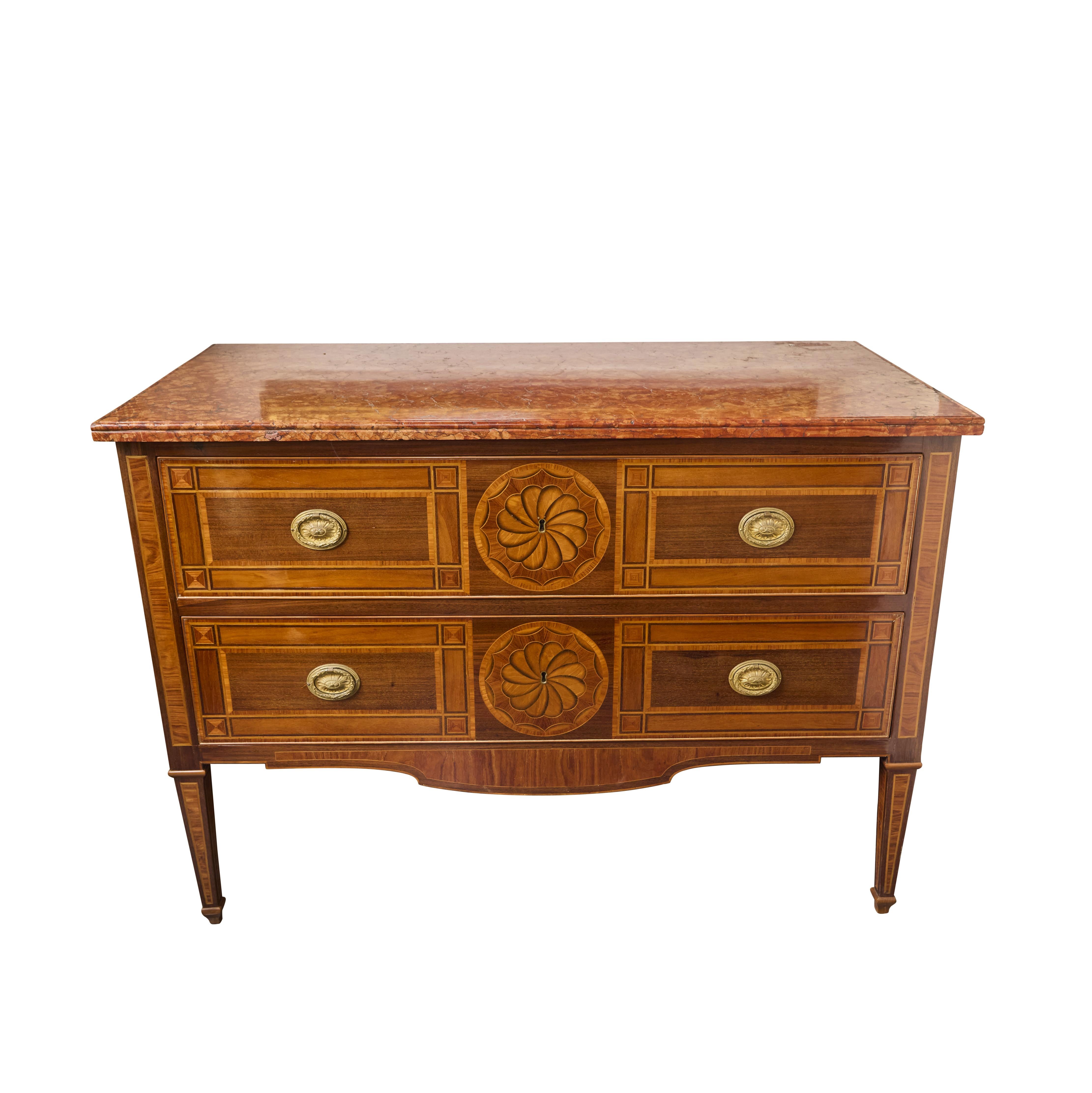 Pair walnut and pear-wood veneered, marquetry commodes, with medallions on the 2 drawers and tapered legs.  Gilded bronze mounts and rouge marble tops.
