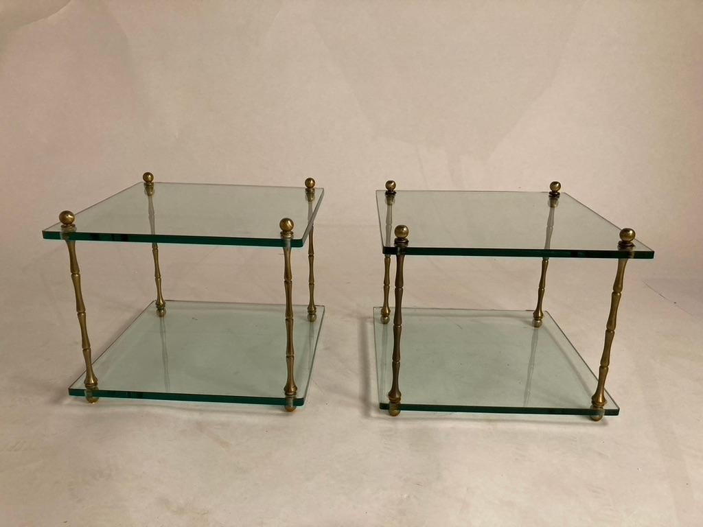 Elegant pair of mid 20th century Italian square side table with thick glass top and base joined by four segmented legs with ball feet and ball finials. A very clean and modern look. The perfect side or end tables for the contemporary interior or