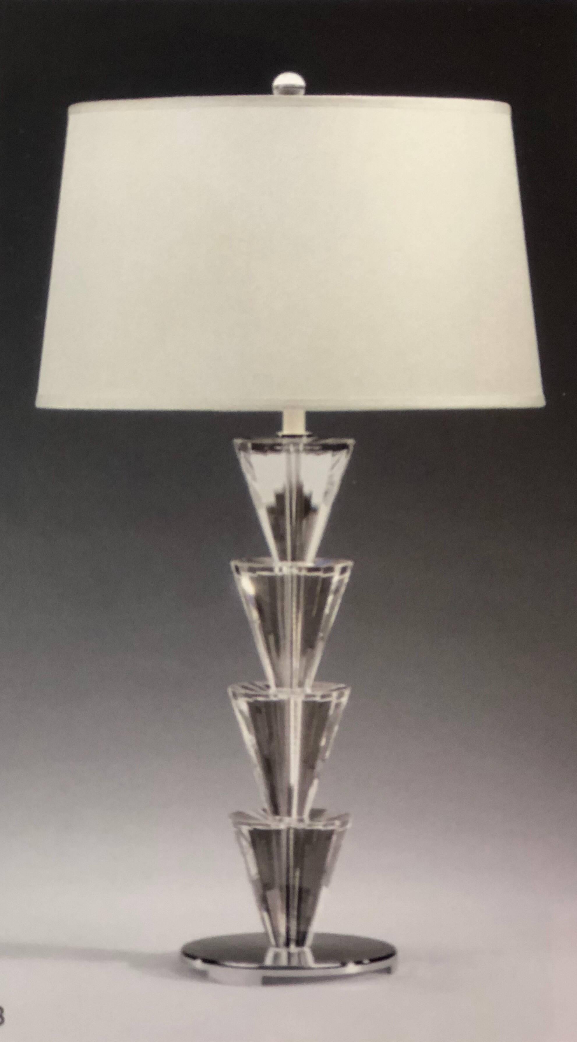 Two elegant pairs of Italian solid crystal and silver plate table lamps in the style of Fontana Arte each featuring a series of four stacked crystal cone forms supported by silver plated base and an internal silver stem.

UL wired for 1 Edison