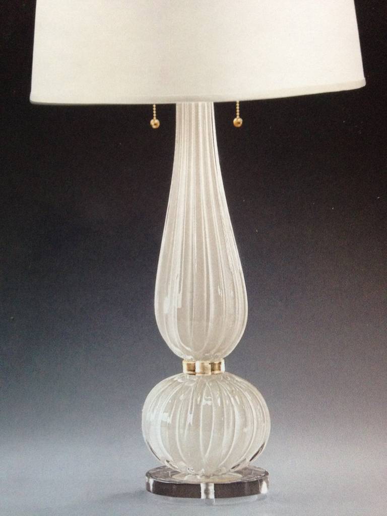 Pair of elegant hand blown contemporary Midcentury style Venetian glass table lamps in white and gold in the modern neoclassical spirit in the style of Barovier e Toso. Shades are for demonstration only and are not included. 

Priced and sold as a