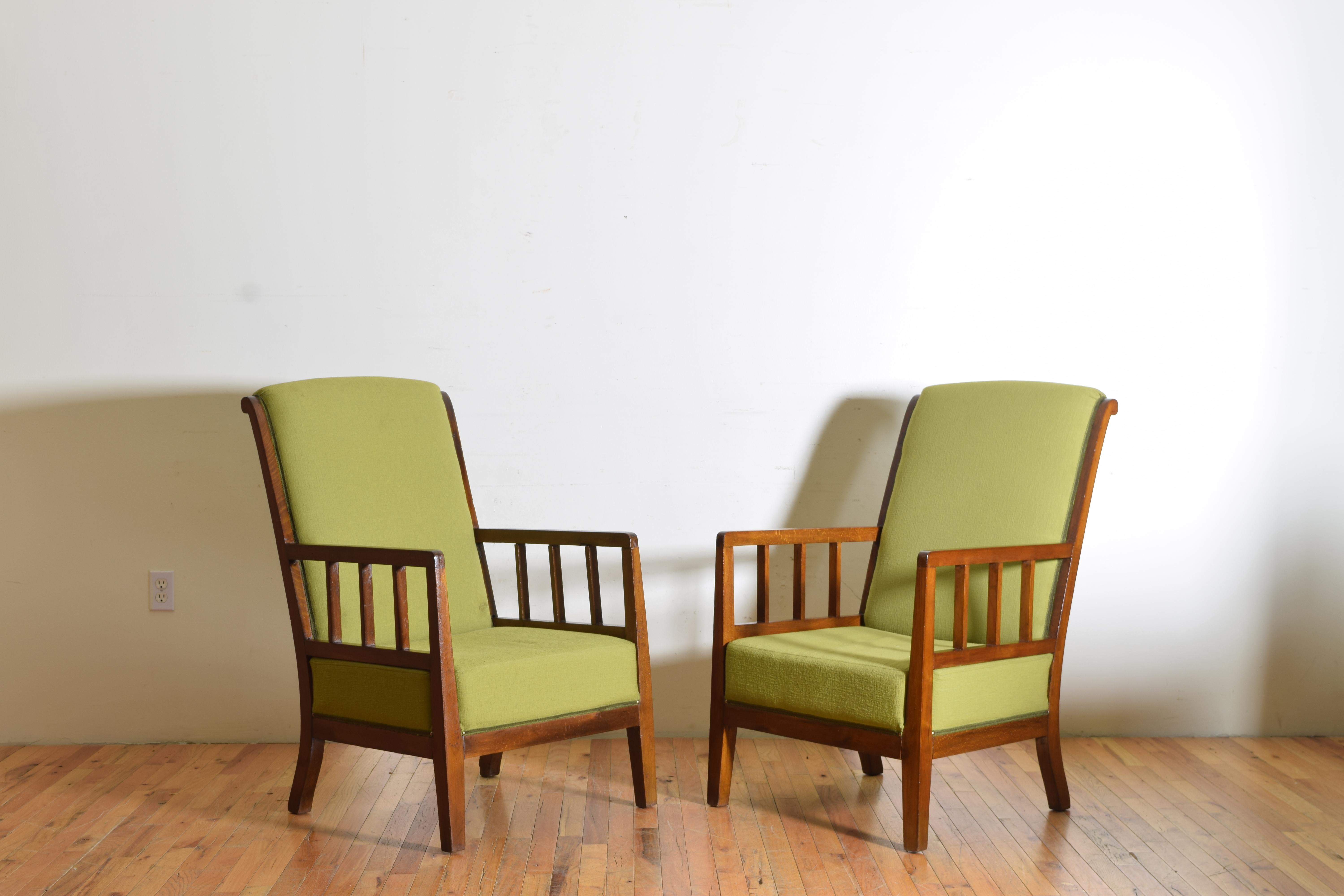 Of generous proportion and having sloped upholstered backrests and tight seats, the wooden frames with open arms supported by vertical slats, formerly of the Bauer Hotel, Venice, Italy.