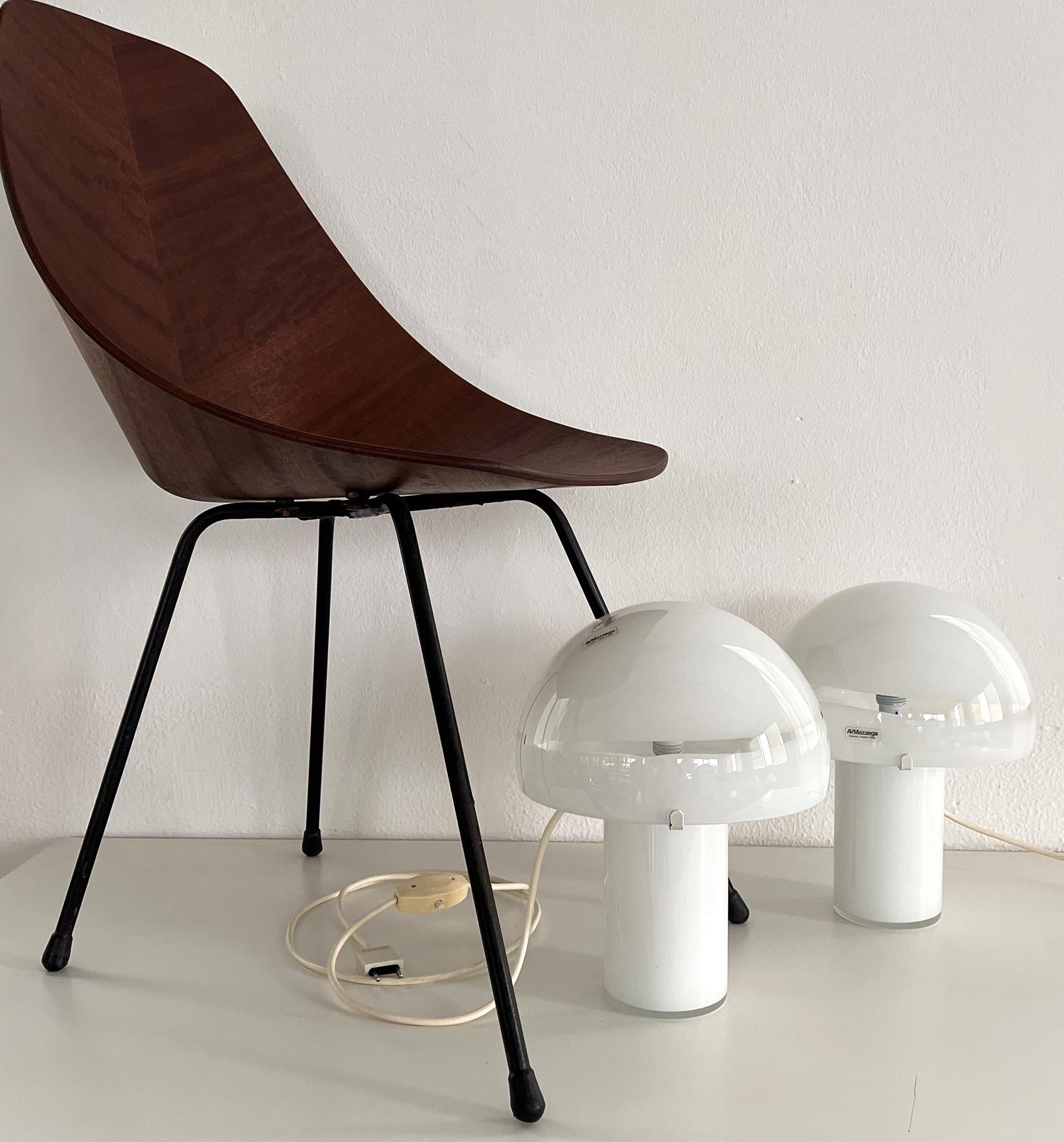 Beautiful set of two Mushroom table lamps, produced by Mazzega, Murano, Italy.
The mushroom shaped lights are hand-crafted in shiny white color, the mushroom head con be easily removed. 
The table lamps are equipped with a 4-position light switch