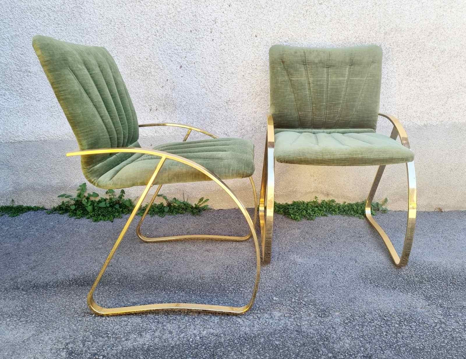 Pair of Italian modern chairs with gold chromed structure, padded on seat and back and covered in original green velvet.
They are made in Italy in the 70s
