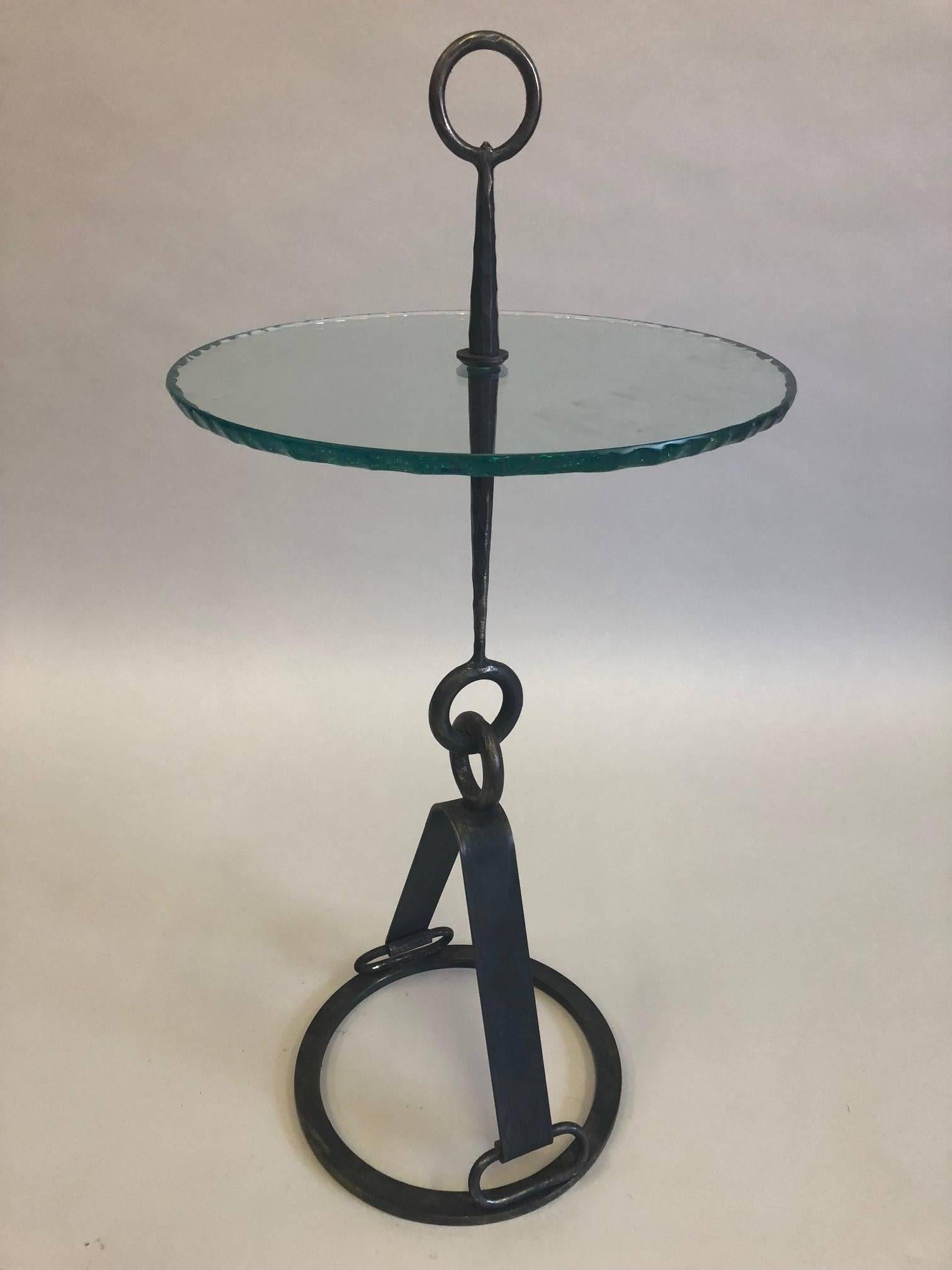 Rare and exquisite pair of Italian Mid-Century Modern neoclassical hand-hammered iron side tables or end tables or gueridons or cocktail tables by Giovanni Banci for Hermes

The tables feature stunning forms that transcend modern and neoclassical