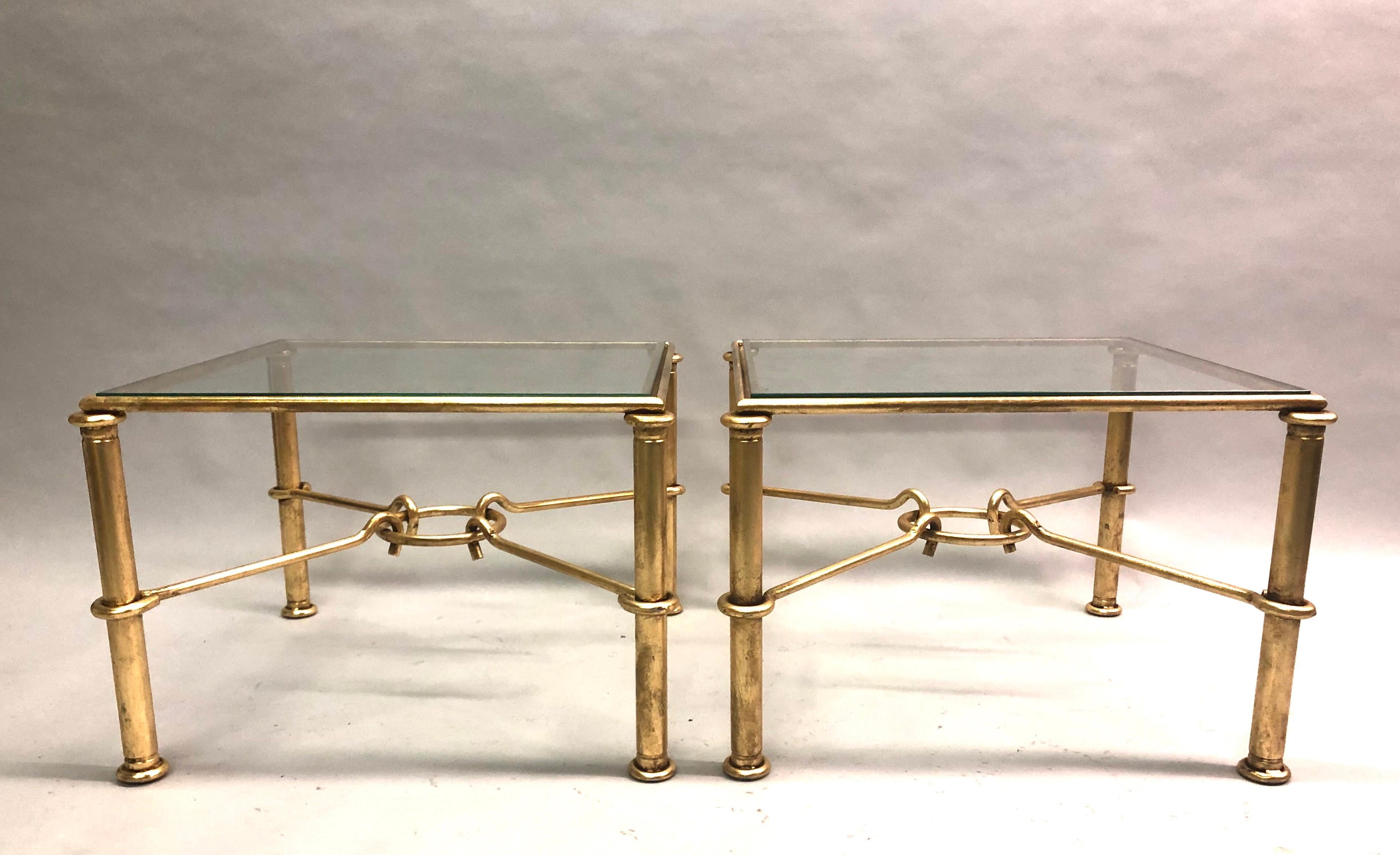 Elegant, timeless pair of Italian Mid-Century Modern neoclassical gilt iron side or end tables by the sculptor or designer, Giovanni Banci for Hermes. The pieces are also designed to fit together as a coffee or cocktail table and have Classic Hermes