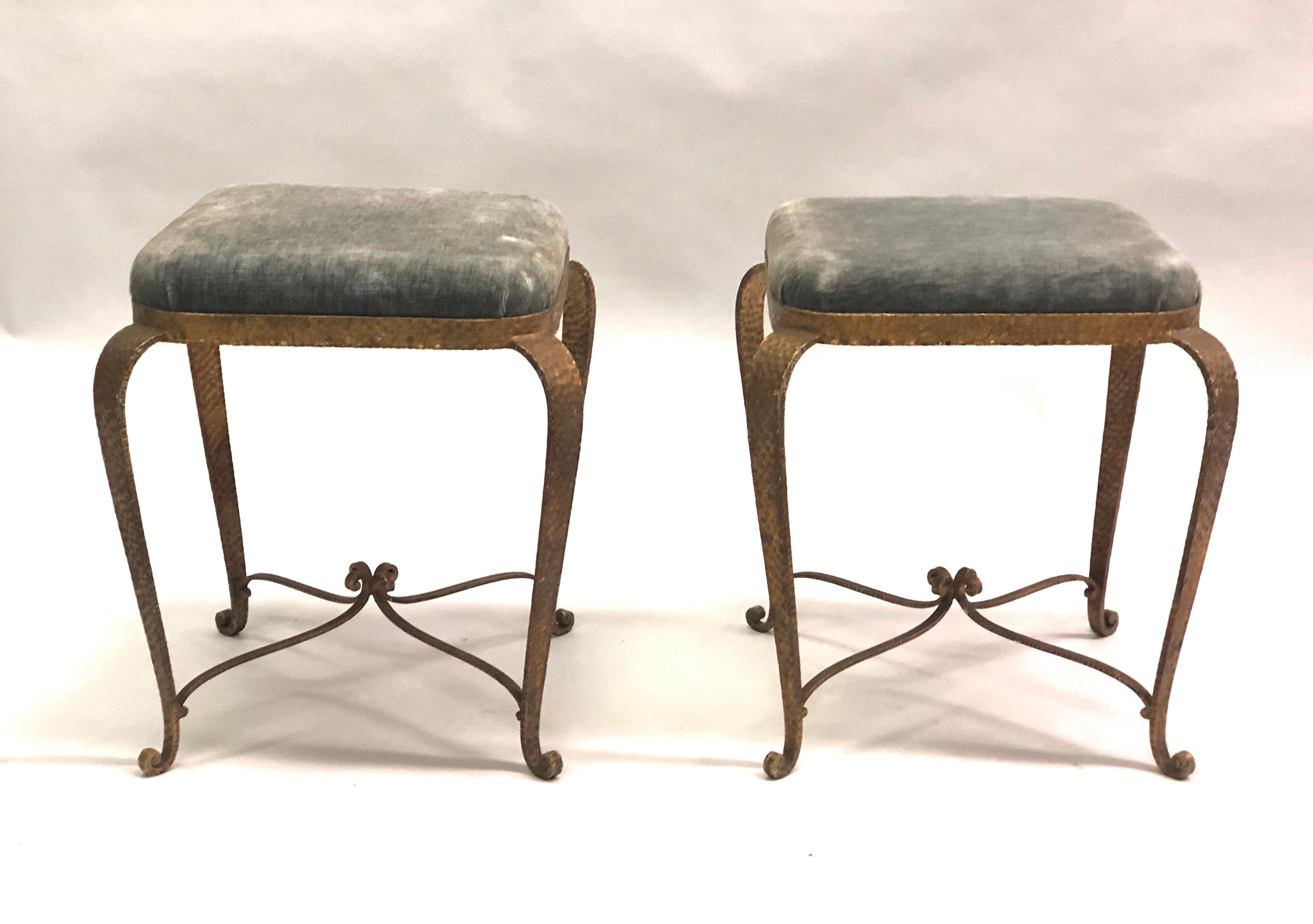 Pair of Italian Mid-Century Modern neoclassical hammered, wrought iron and gilt benches or stools by Pier Luigi Colli. Original upholstery.