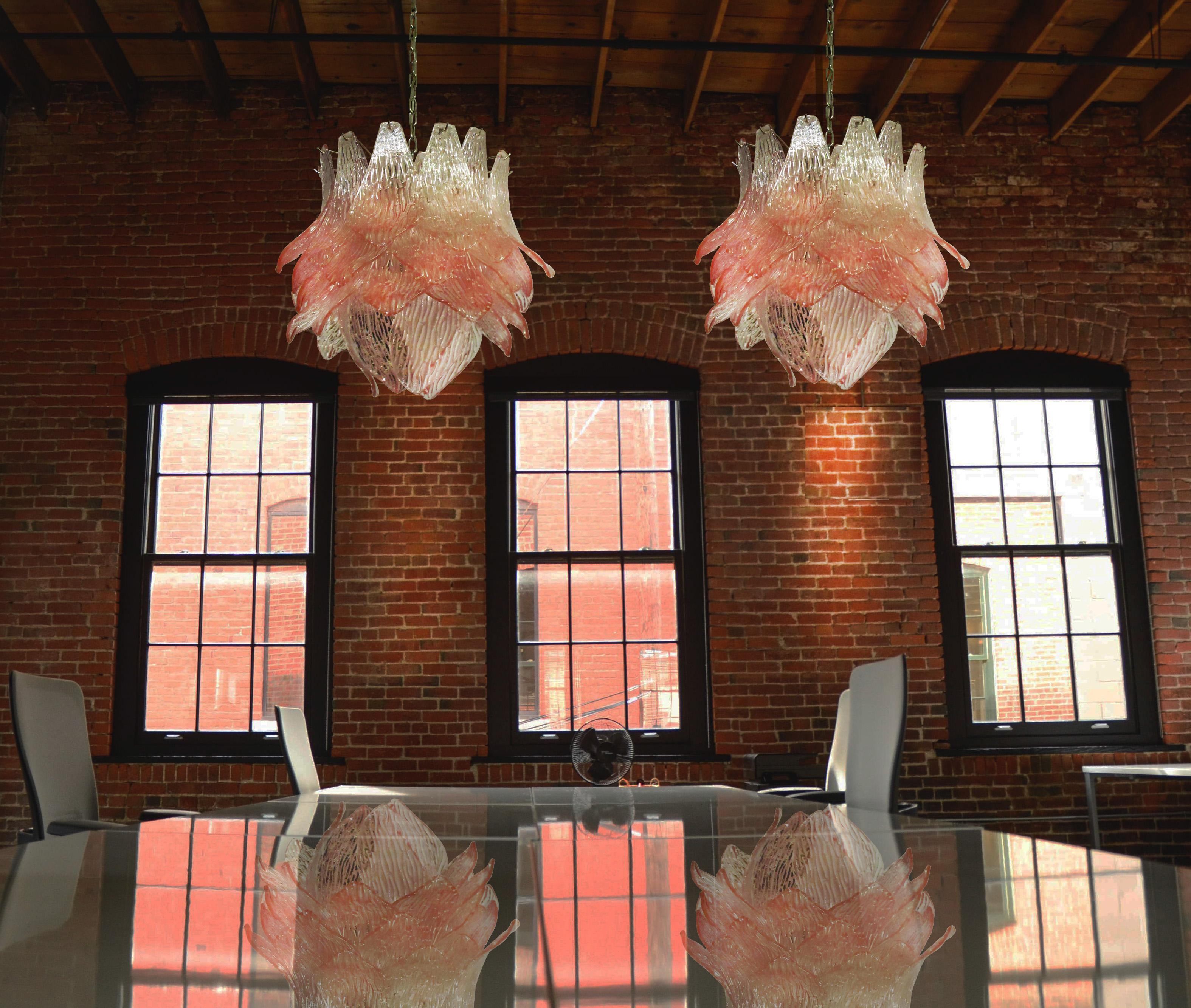 Beautiful and huge pair Italian Murano chandeliers composed of 38 splendid pink glasses that give a very elegant look. The glasses of this chandelier are real works of art. This chandelier is shaped like a blossoming flower.
Period: