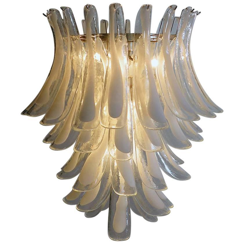 Pair of huge Italian vintage Murano chandeliers made by 52 glass petals (transparent crystal, smooth outside, with crystal powder and then rough inside
Period: 1970s-1980s

Dimensions: 55.10 inches (140 cm) height with chain, 29.50 inches (75 cm)