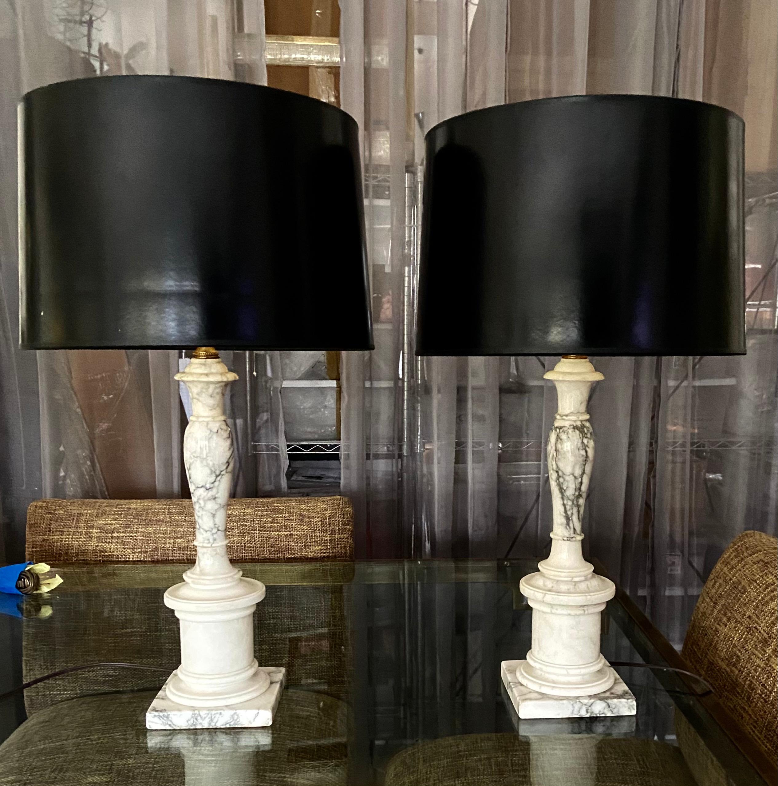 Pair of hand carved slender shape neoclassic style alabaster table lamps. Newly wired with new brass fittings and cords. Shades are not included.

Height to top of alabaster is 16”, overall height to top of sockets is 21