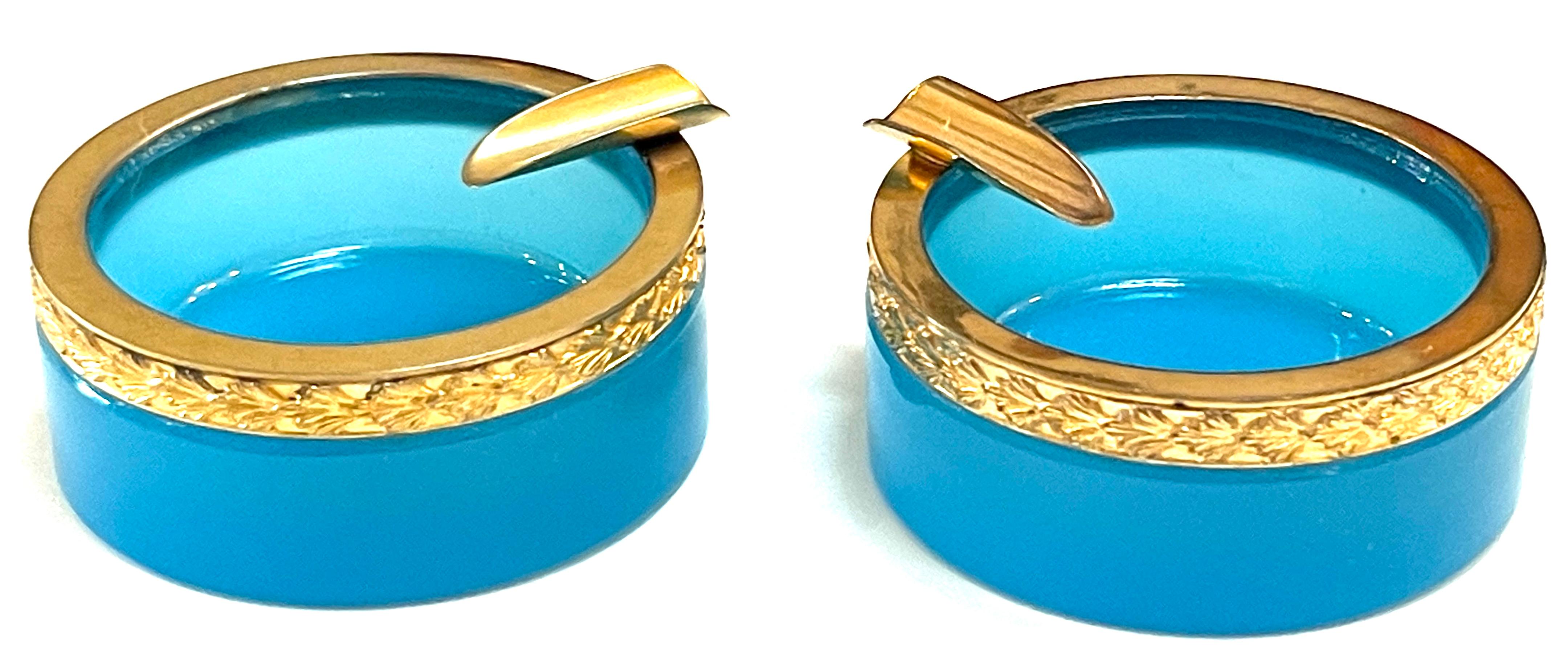Pair of Italian Neoclassic Ormolu and Blue Opaline Diminutive Ashtrays/Portacenere
Italy, circa 1950s

A luxurious pair of Italian Neoclassic Ormolu and Blue Opaline Diminutive Ashtrays/Portacenere. Crafted with indulgence in mind, each ashtray