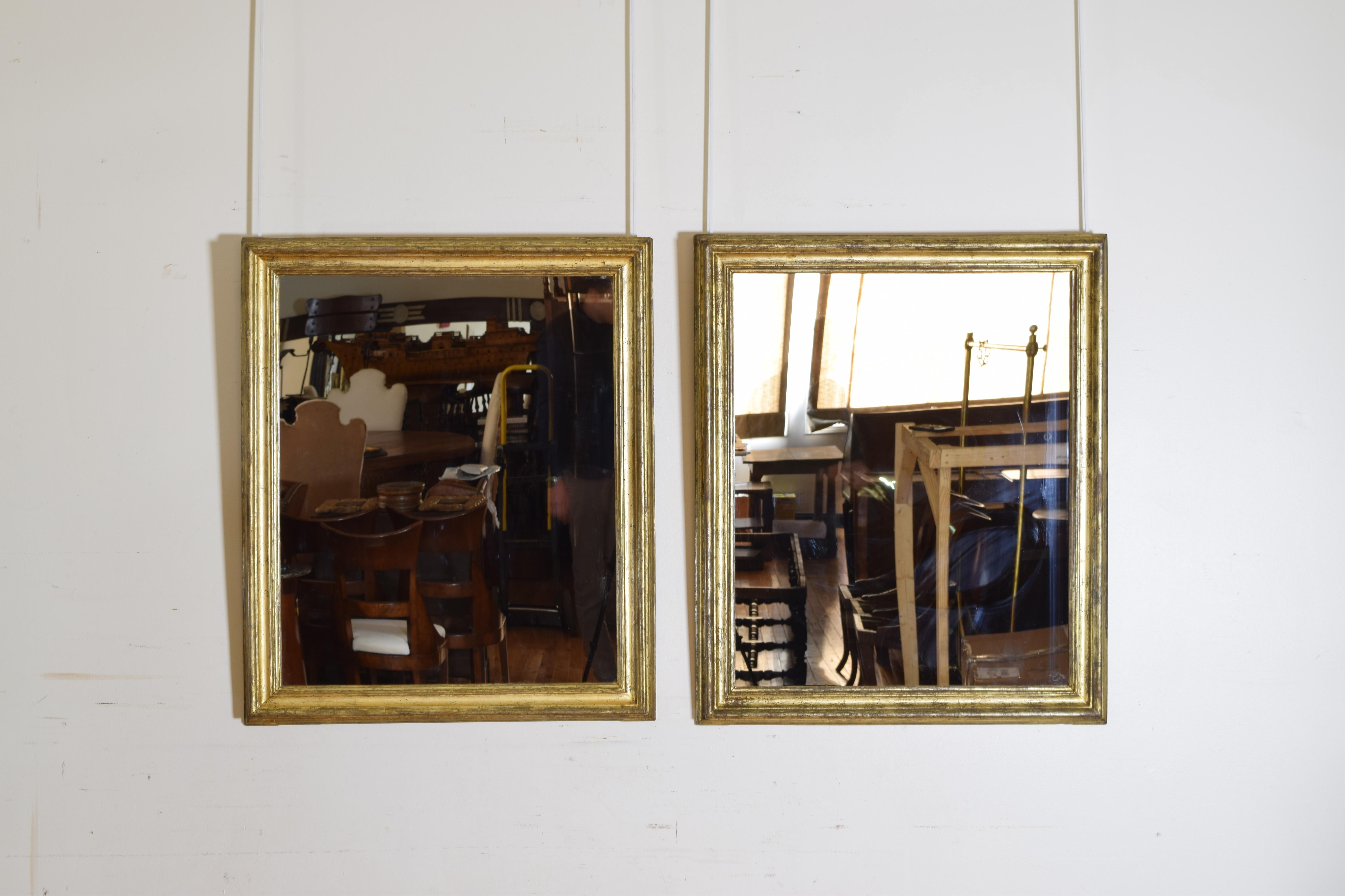 Each frame with several layers of moldings, covered in silver with amber lacquer, the process known in Italy as 