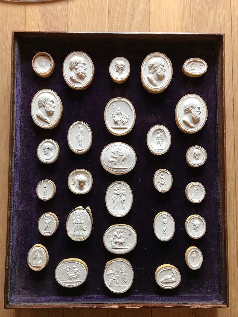 This is actually a set of 73 loose Grand Tour Italian plaster intaglios. They are in velvet lined trays for display and to be photographed. Ready to be framed in the way you prefer, these could make a set of four to eight framed pieces. Or more