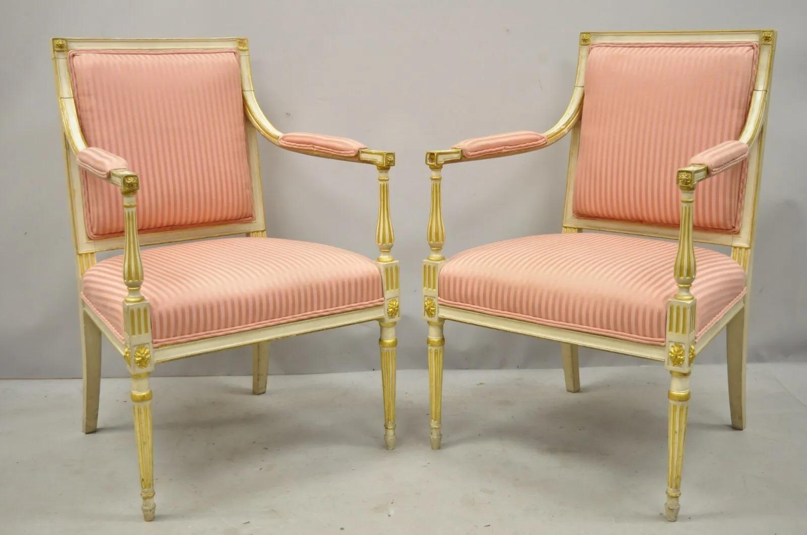 Pair of Italian Neoclassical Parcel Gilt Cream French Louis XVI Directoire Arm Chairs (A). Item features dream and gold gilt finish, solid wood frame, upholstered armrests, nicely carved details, tapered legs, great style and form. Circa Early