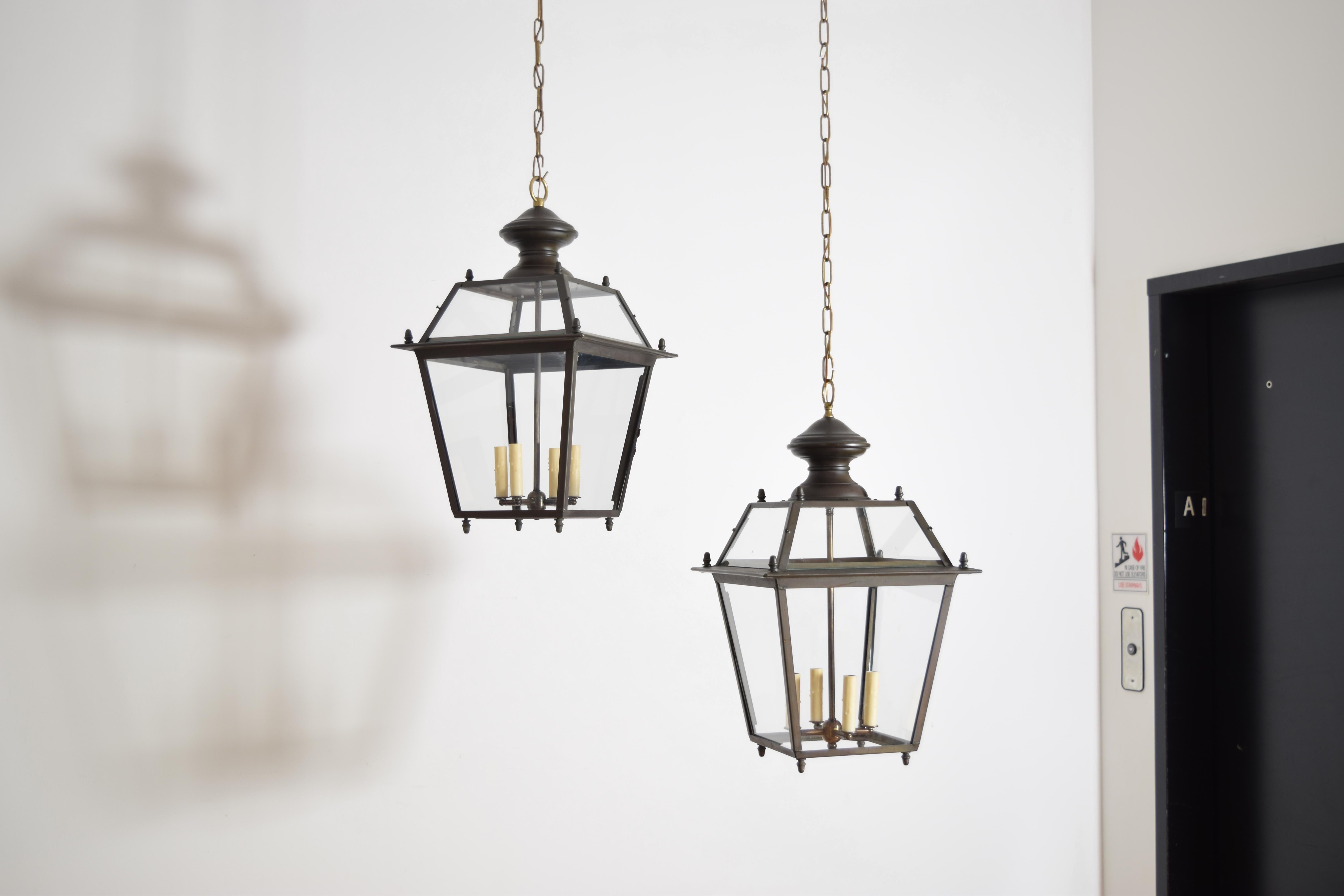 each lantern with distinct upper and lower sections all having individual panes of glass, newly electrified with 4-light clusters