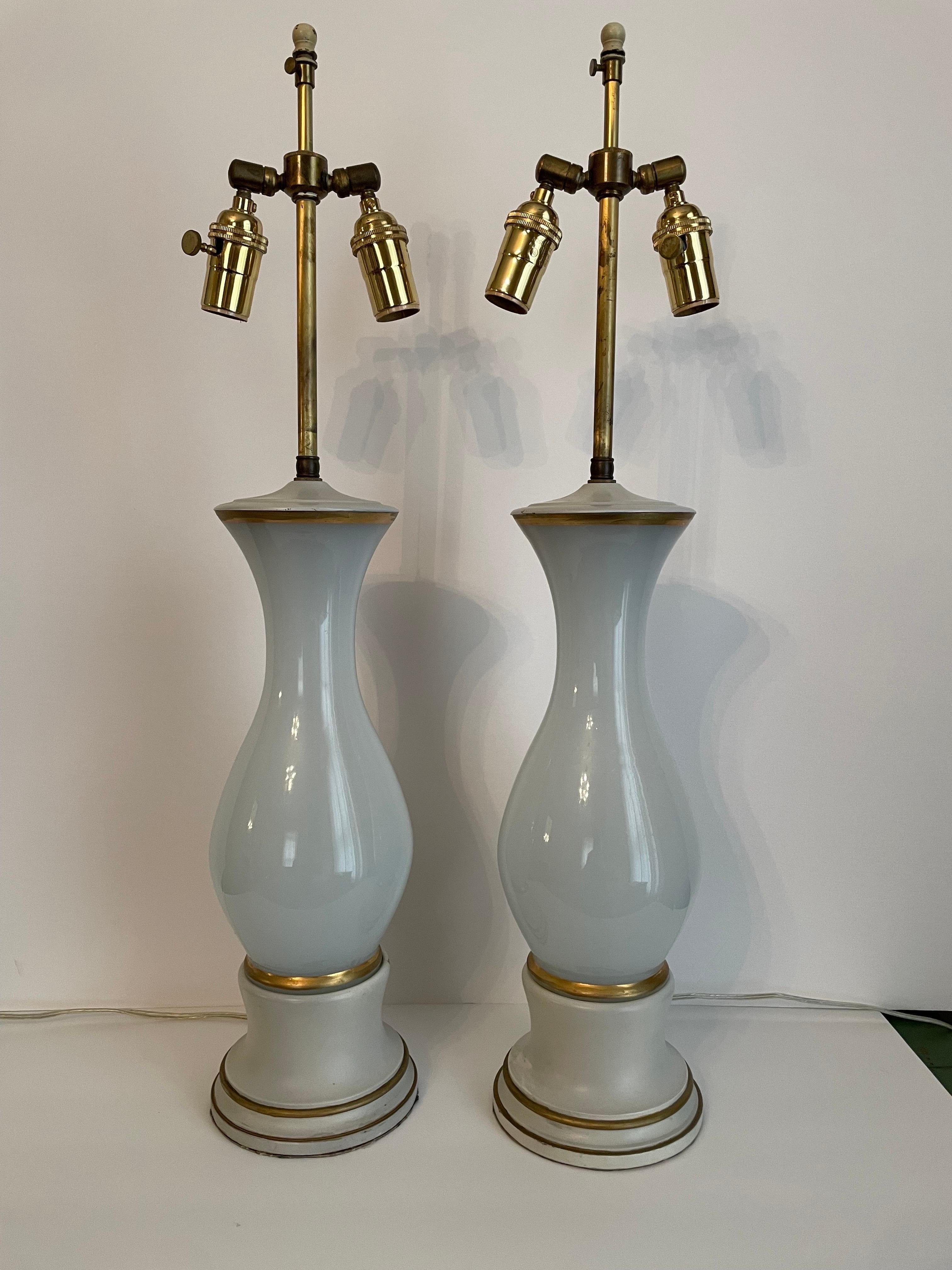 Pair Italian Opalescent glass lamps on gilt and painted bases. Two sockets each with adjustable shade rests. Rewired with new brass three way sockets and long cords. Good working condition.