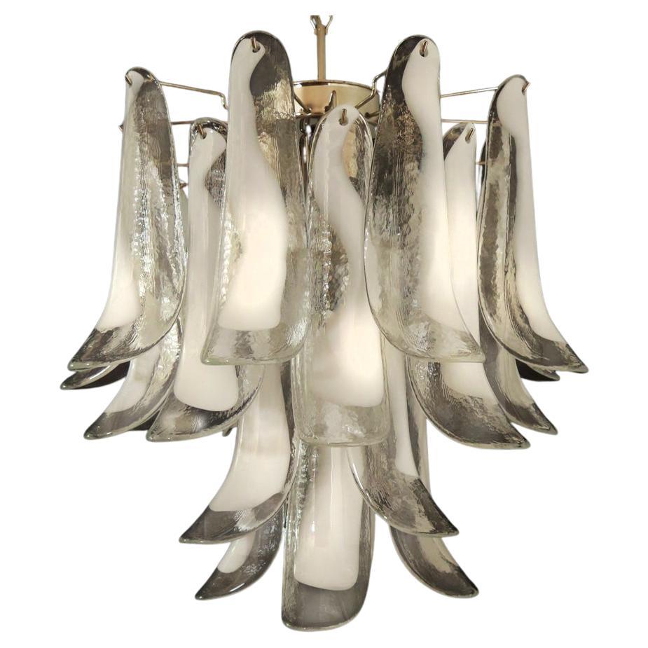 
Pair Italian vintage Murano chandeliers made by 26 glass petals (trasparent and white “lattimo”) in a chrome frame.
Period:1980's
Dimensions:47,250 inches (120 cm) height with chain; 23,62 inches (60 cm) height without chain; 19,70 inches (50 cm)