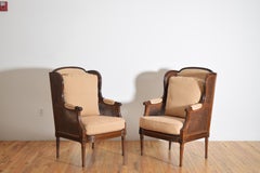 Pair Italian, Piemontese, LXVI Style Carved Walnut & Caned Bergeres, late 19th c
