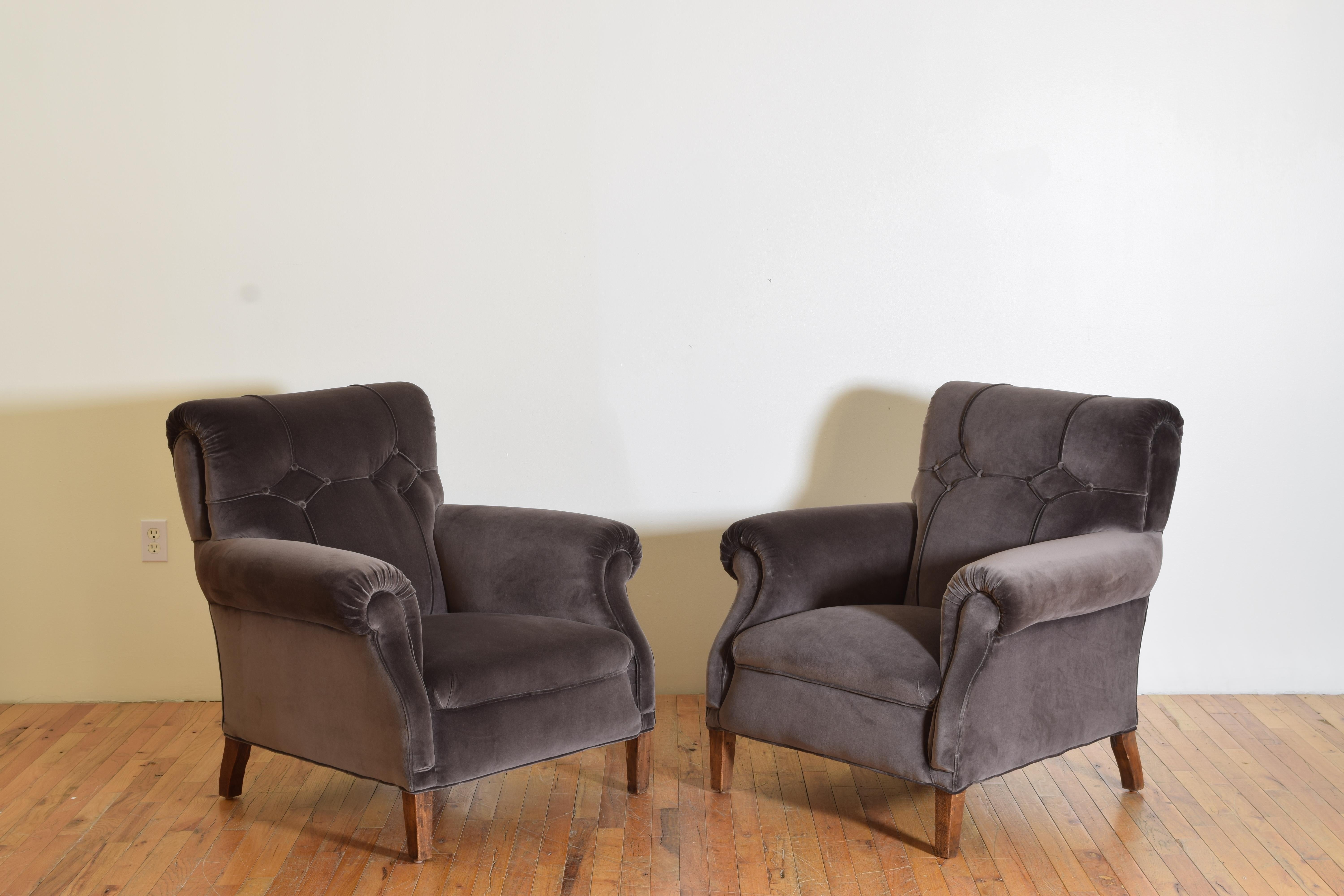 Formerly upholstered in leather these chairs now in velvet and retaining the original upholstery pattern, raised on square tapering legs.