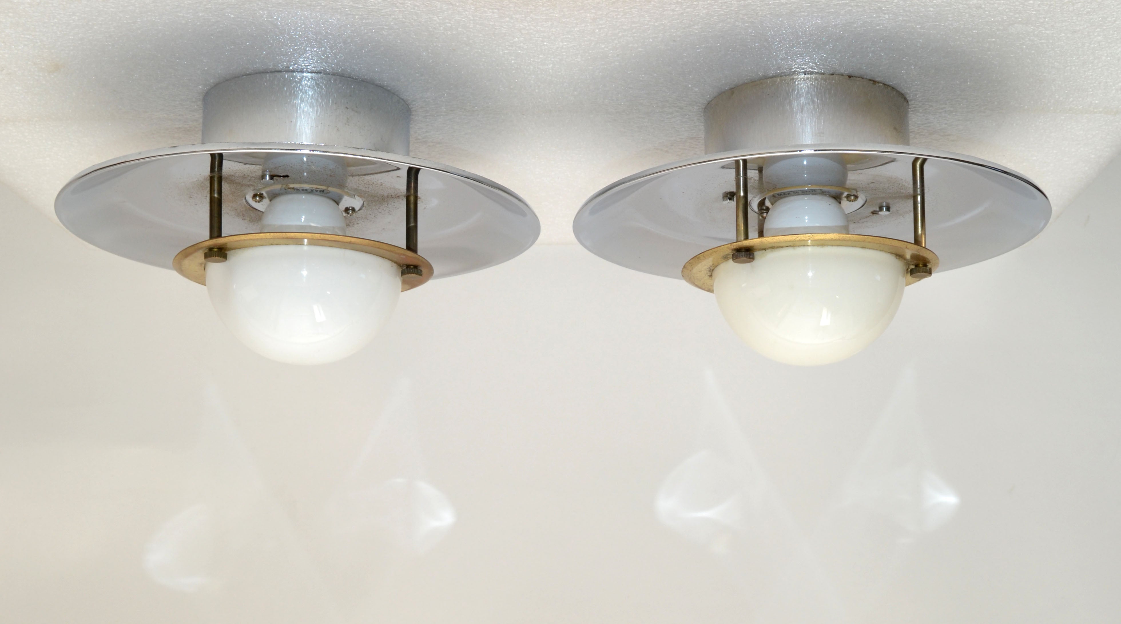 Pair of Mid-Century Modern round chrome, brass sconces, wall light or flush mount.
Unique way of attaching the socket part to the Top, easy to change the light bulbs, just turn into the 2 holes and click.
US wiring and each takes a small regular 60