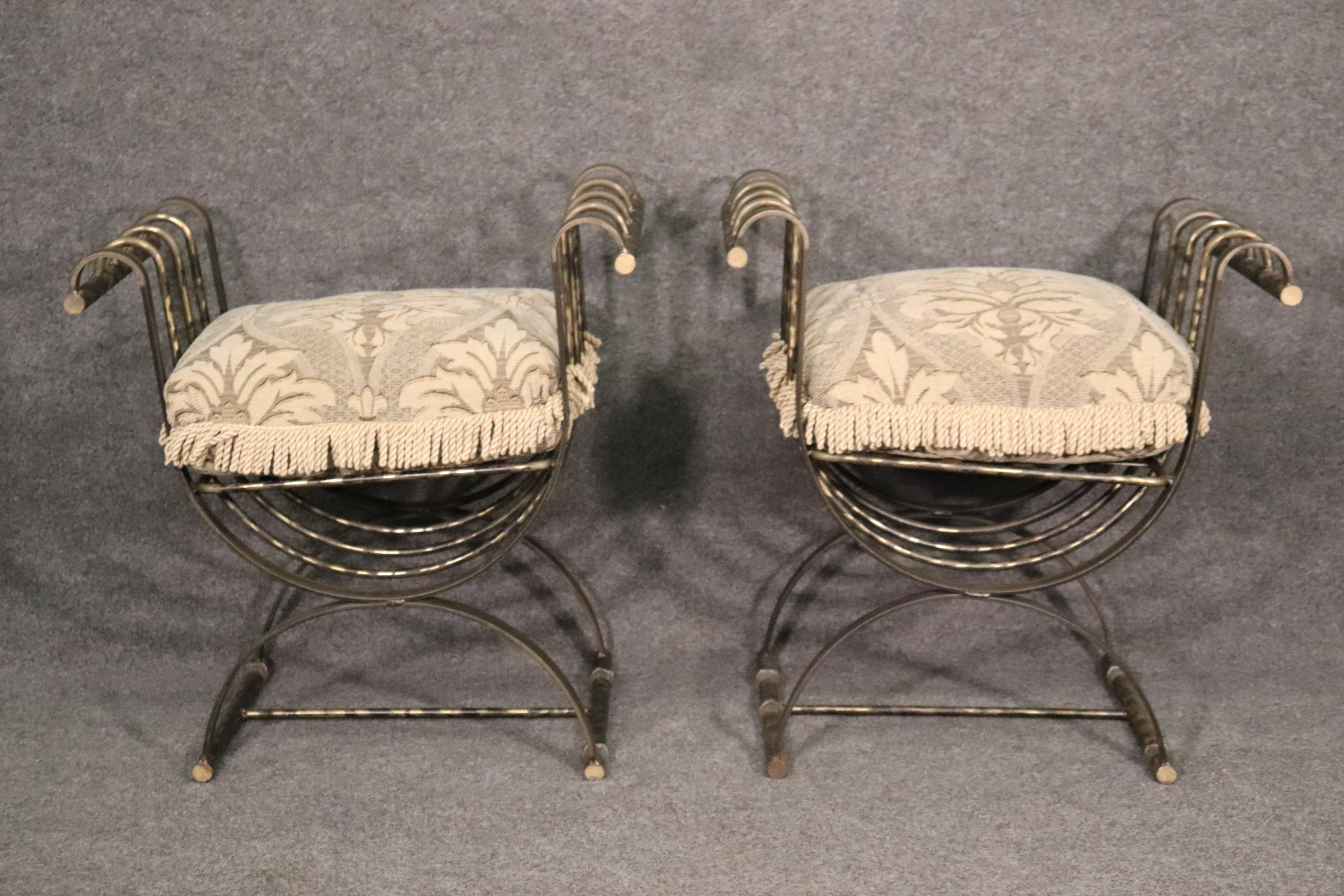 These bronze finished iron chairs are designed in the style of the great savonarolla chairs of Italy and Spain. They are made of wrought iron but have a bronze finish. They are heavy and measure 29 tall x 27 wide x 18 deep and the seat height is 18