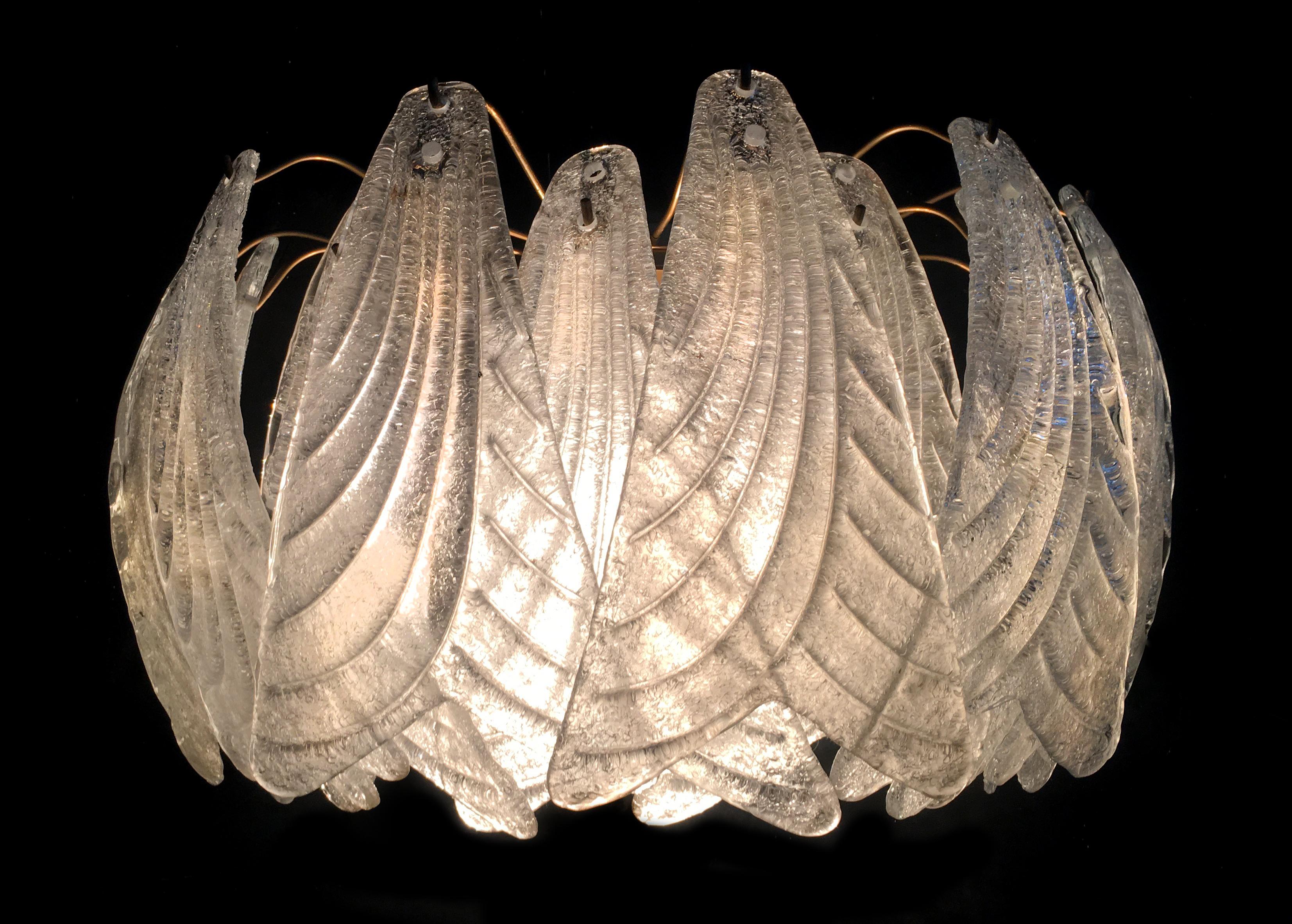Luxurious pair of sconces in Murano glass.