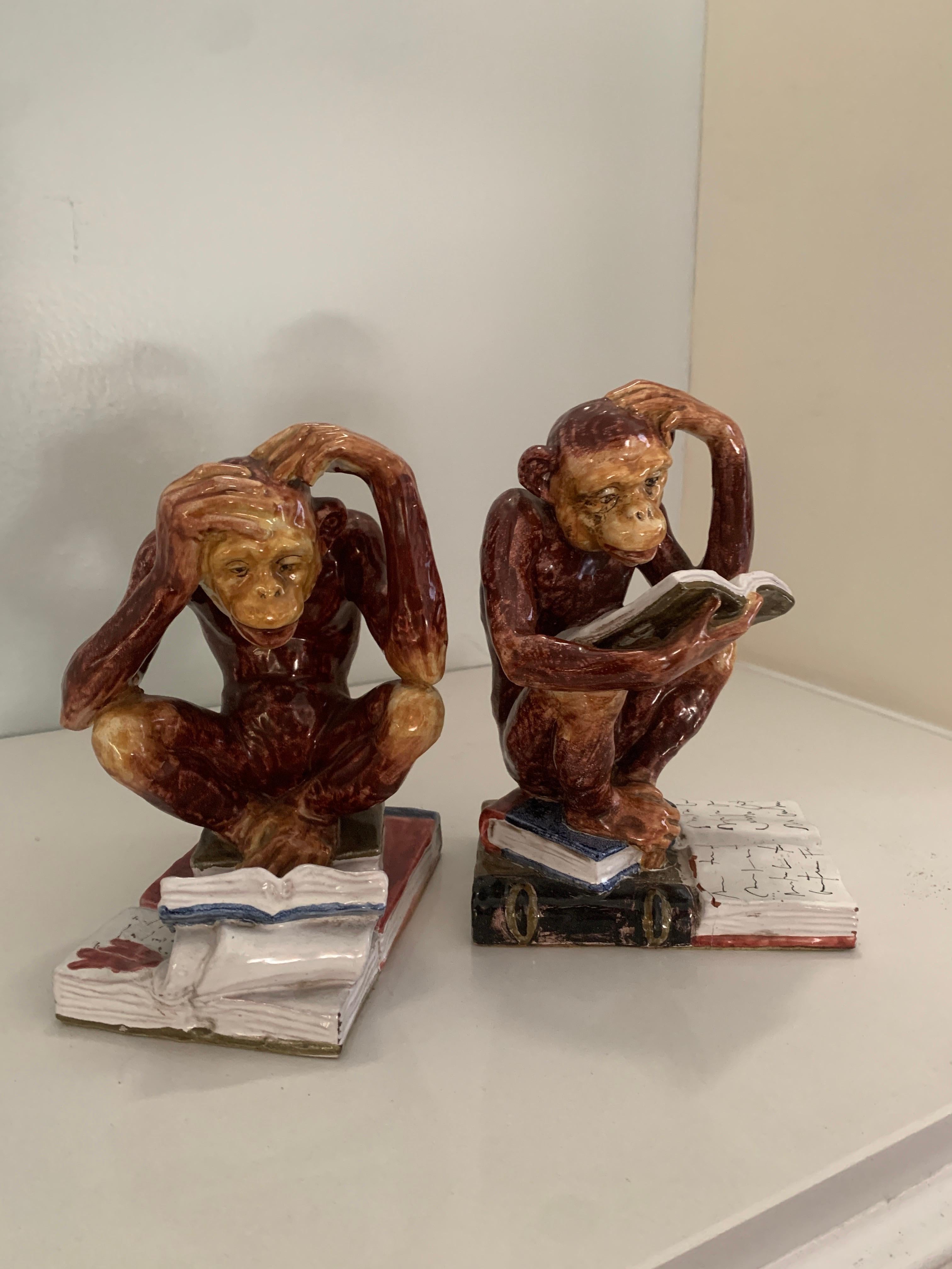 Pair of Italian Majolica Bookends. The pair are of good weight ceramic or terra cotta to hold larger books. A compliment to any shelf or desk, especially working well in a Childs room due to the whimsical nature of the studious monkeys