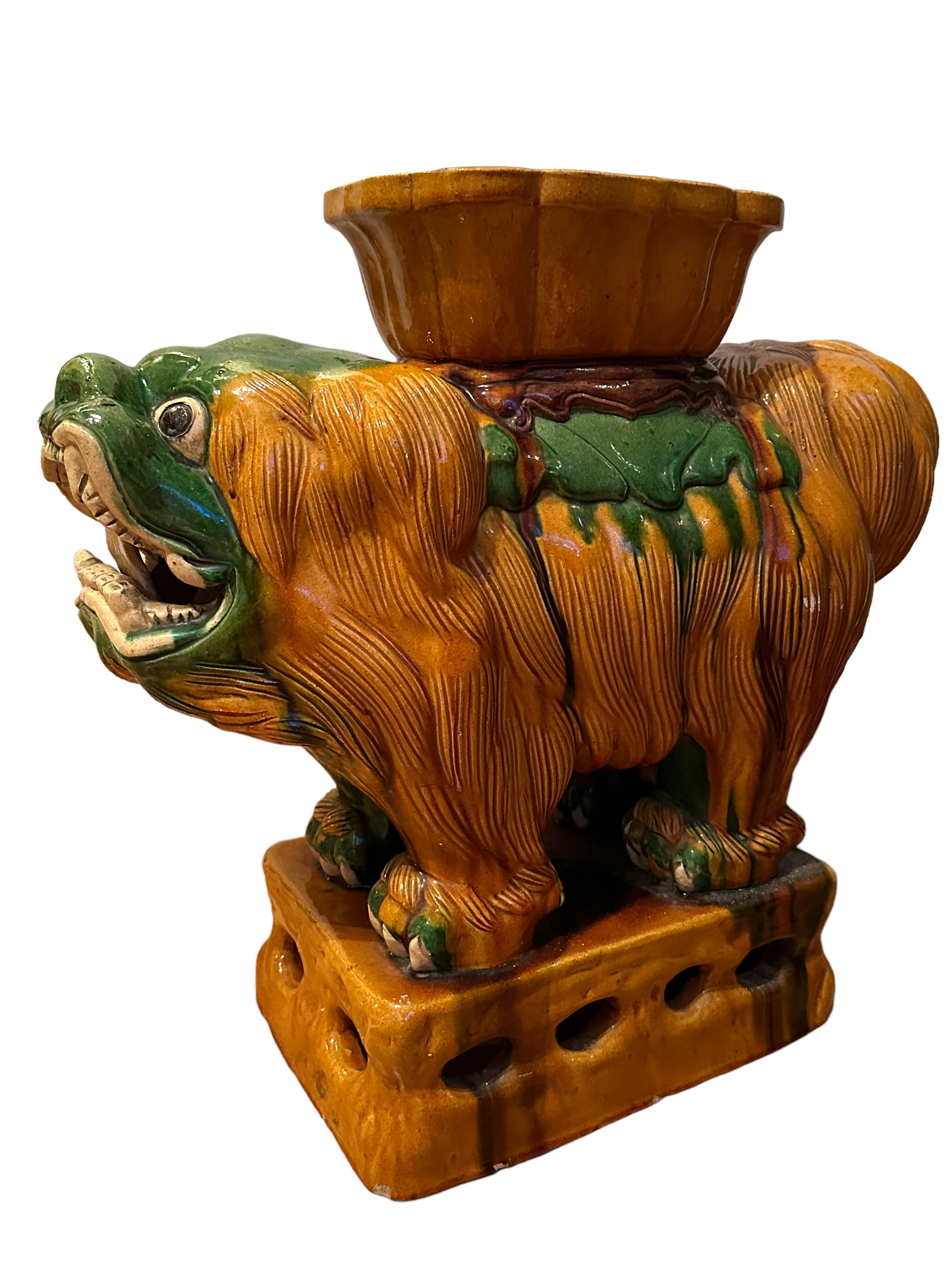 An outstanding pair of two Foo Dog statues in glazed and hand painted terracotta. Perfectly placed on a pedestal, lifelike and life-size representations of this majestic being, stern, watchful and obedient at the same time.
Elegant and of