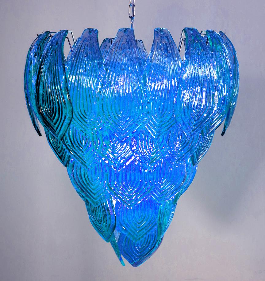 Beautiful and huge pair of Italian Murano chandeliers composed of 52 splendid turquoise glasses that give a very elegant look. The glasses of this chandelier are real works of art, the weight of this chandelier is 50 kg.
Period: Late 20th